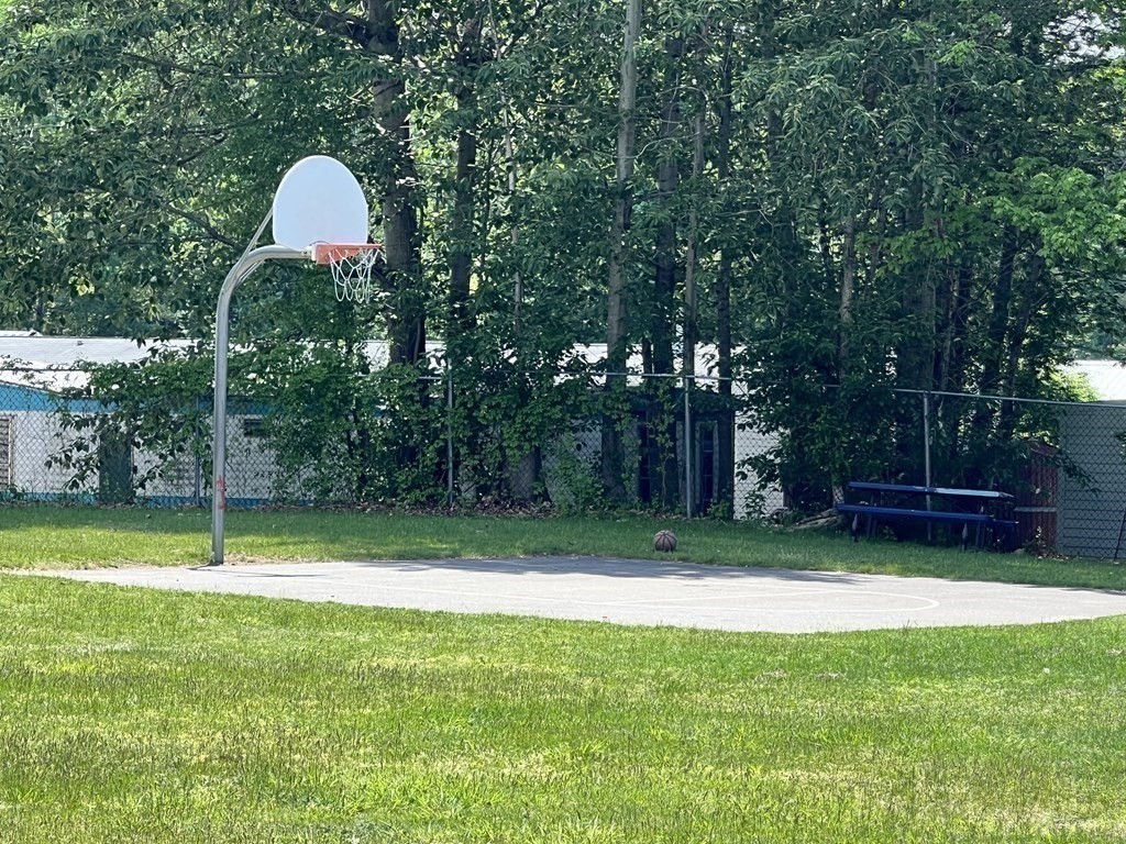 270 Littleton Road, Unit 109 Chelmsford, MA 01824 - Photo 40 of 41 a backyard of a house with lots of green space and fountain