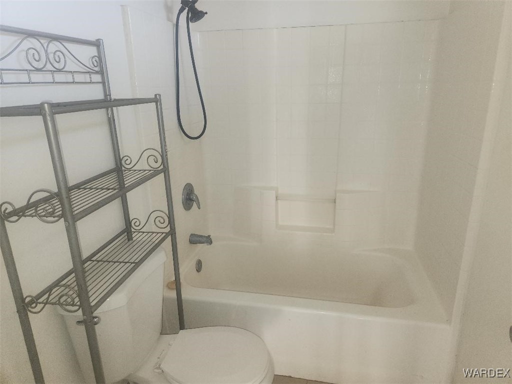 352 Rio Grande Court Bullhead City, AZ 86442 - Photo 11 of 14 a bathroom with a toilet and shower