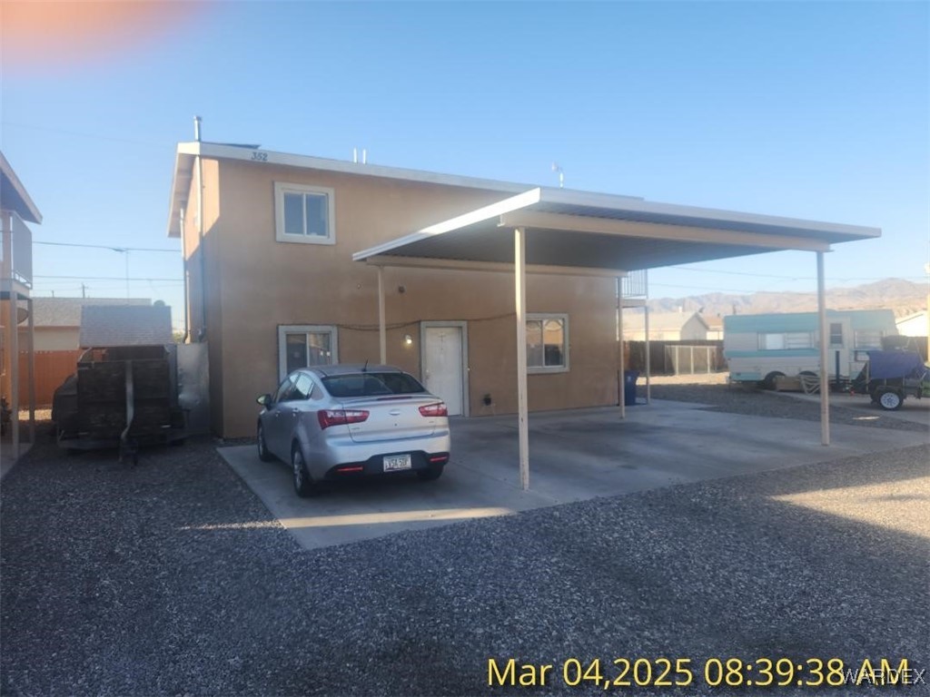 352 Rio Grande Court Bullhead City, AZ 86442 - Photo 2 of 14 a bedroom with furniture and a window