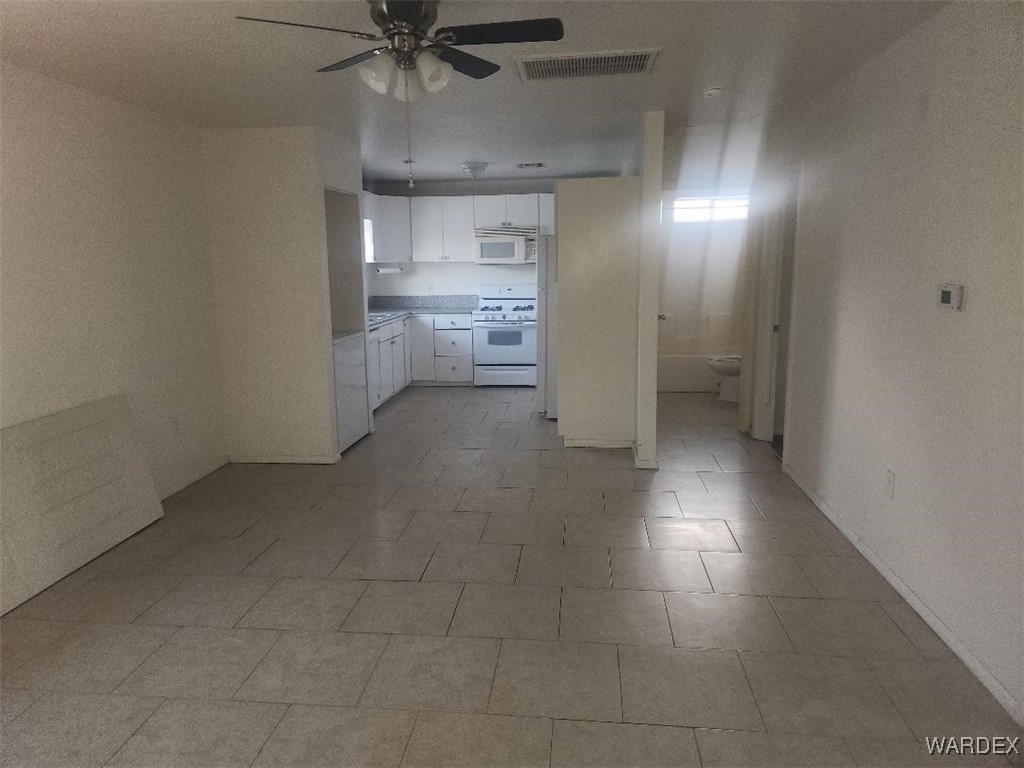 352 Rio Grande Court Bullhead City, AZ 86442 - Photo 6 of 14 a view of a kitchen with a sink and a refrigerator