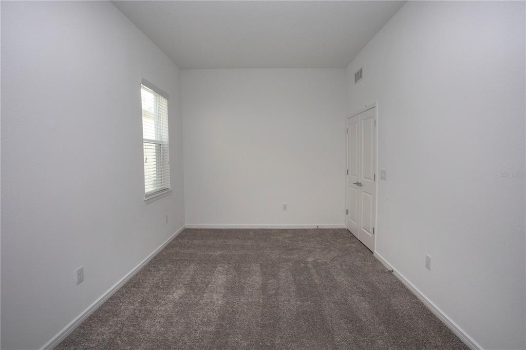 14184 Hammock Crest Way Riverview, FL 33569 - Photo 14 of 54 an empty room with a window