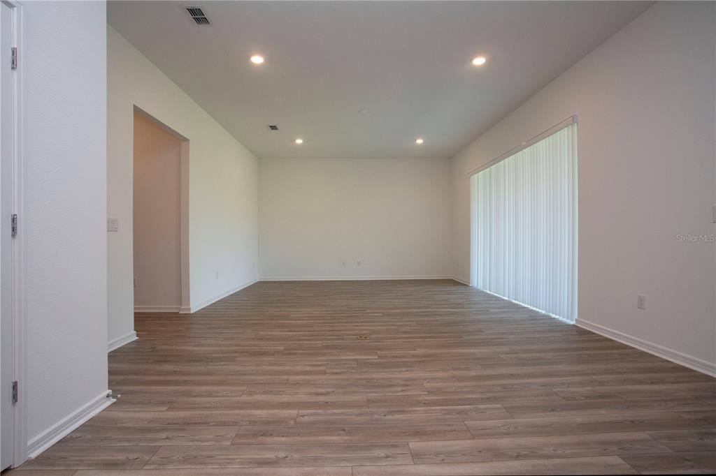 14184 Hammock Crest Way Riverview, FL 33569 - Photo 26 of 54 a view of empty room with wooden floor