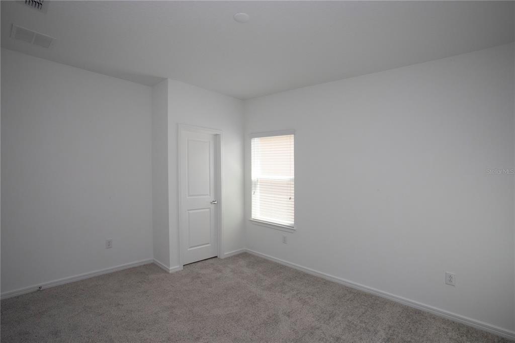 14184 Hammock Crest Way Riverview, FL 33569 - Photo 49 of 54 an empty room with windows