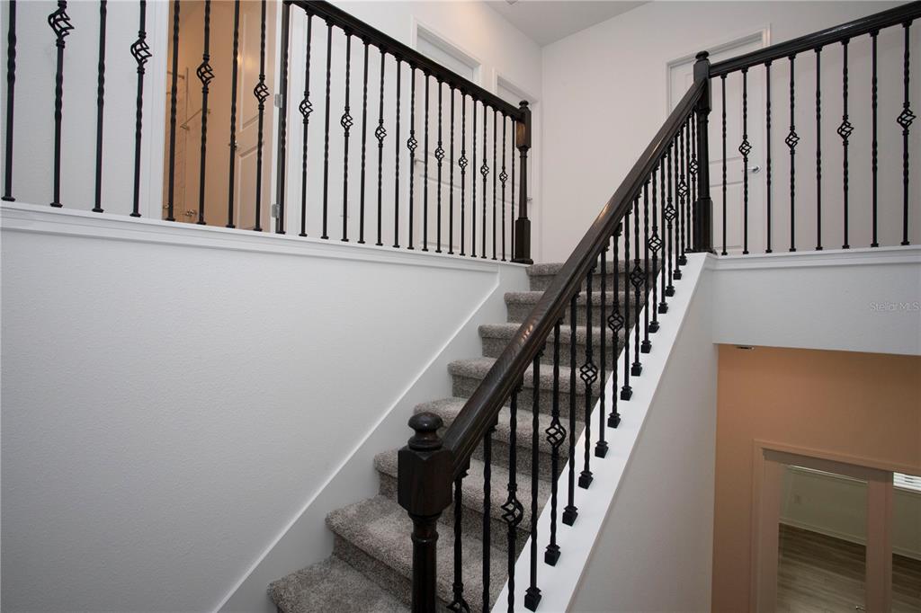 14184 Hammock Crest Way Riverview, FL 33569 - Photo 6 of 54 a view of staircase with wooden floor and staircase