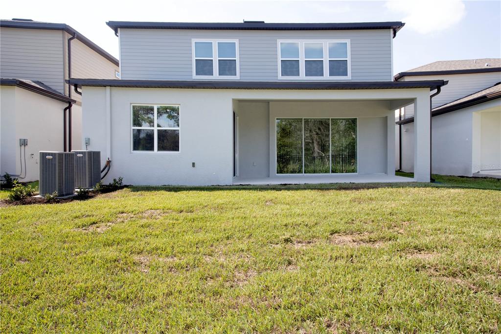 14184 Hammock Crest Way Riverview, FL 33569 - Photo 7 of 54 a view of a house with a backyard