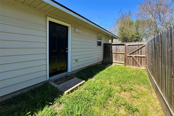 a view of a backyard with a house