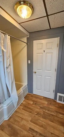 a view of entryway with wooden floor and stairs