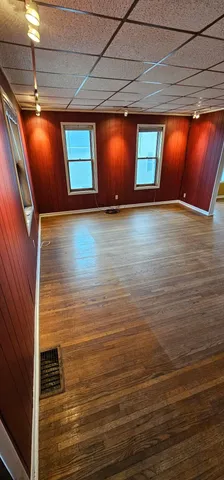 a view of an empty room with potted plants