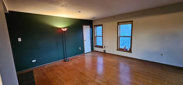 a view of an entryway with wooden floor
