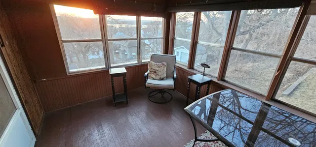 a view of an empty room with a fireplace