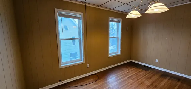 a view of balcony with wooden floor and outdoor seating