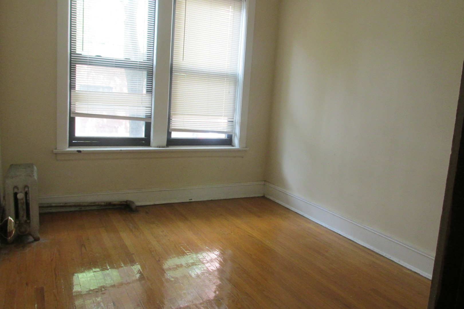 1367 East 56th Street, Unit 2 Chicago, IL 60637 - Photo 5 of 8 an empty room with a window