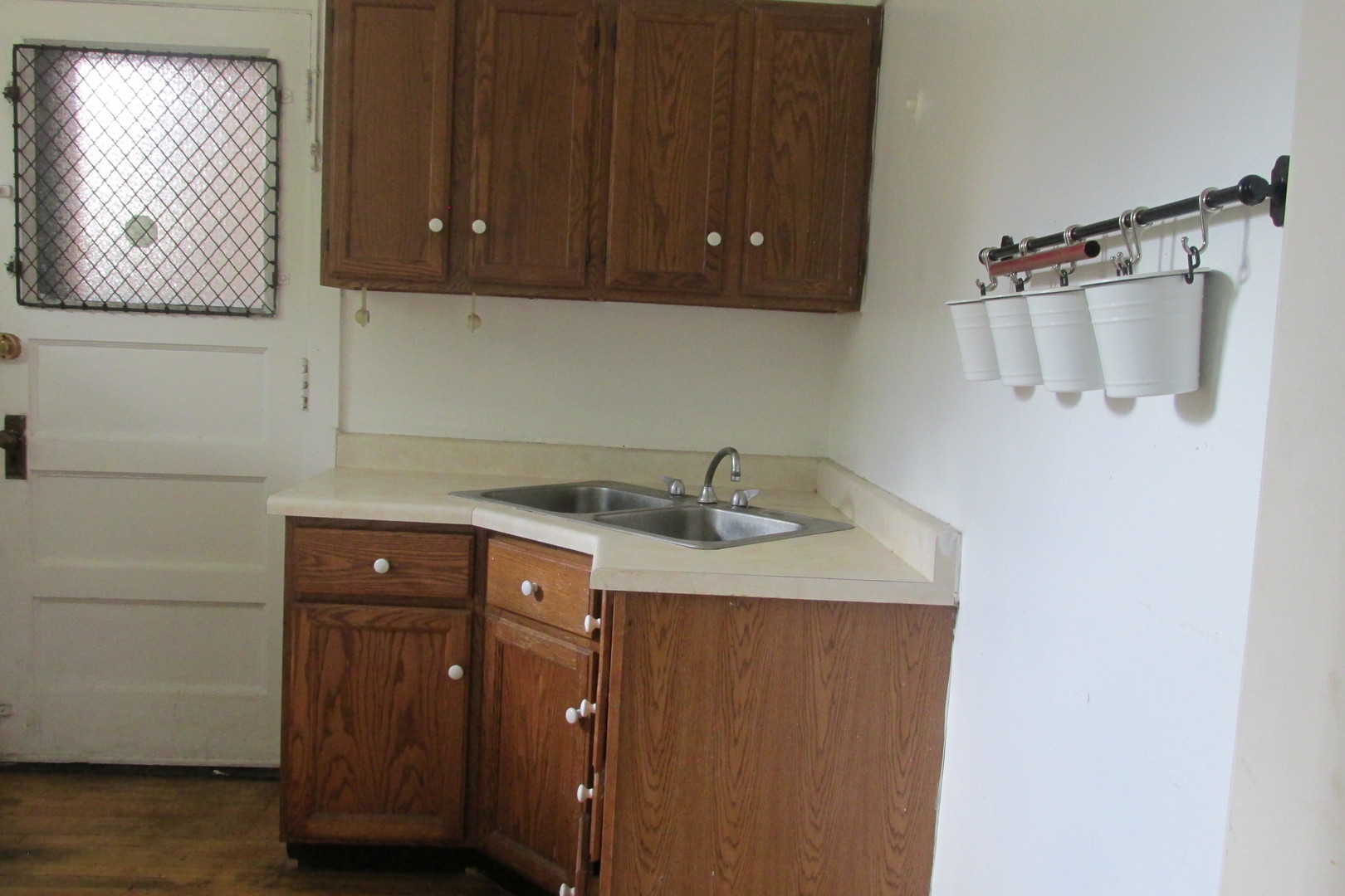 1367 East 56th Street, Unit 2 Chicago, IL 60637 - Photo 8 of 8 a sink with a cabinets
