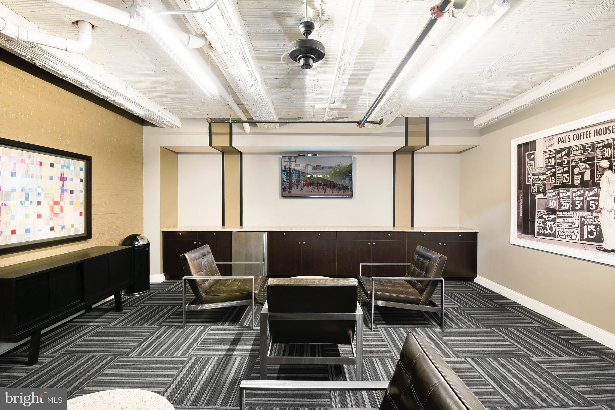 301 North Charles Street, Unit 1BR Baltimore, MD 21202 - Photo 15 of 48 a living room with furniture and a flat screen tv