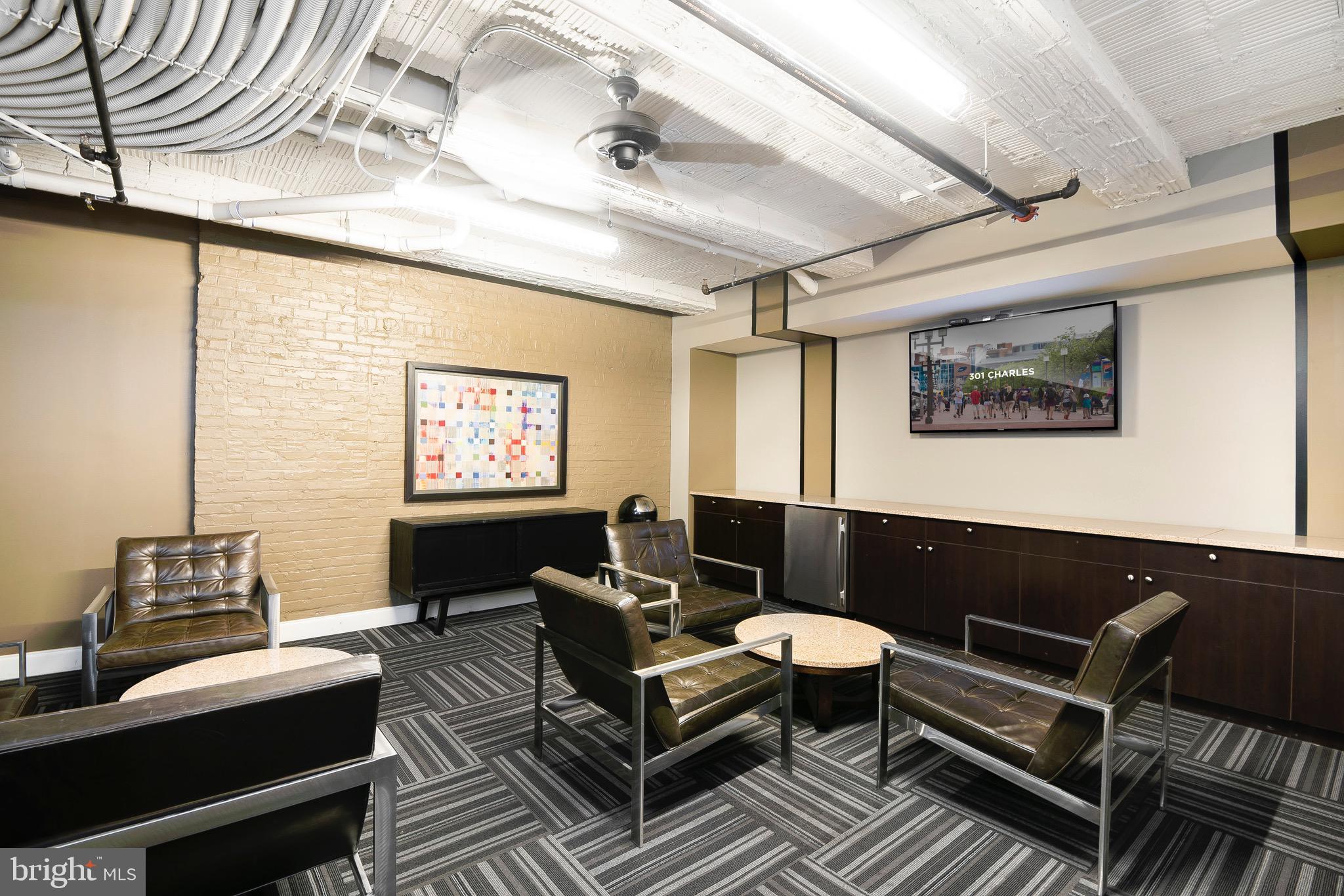 301 North Charles Street, Unit 1BR Baltimore, MD 21202 - Photo 16 of 48 a living room with furniture and a window