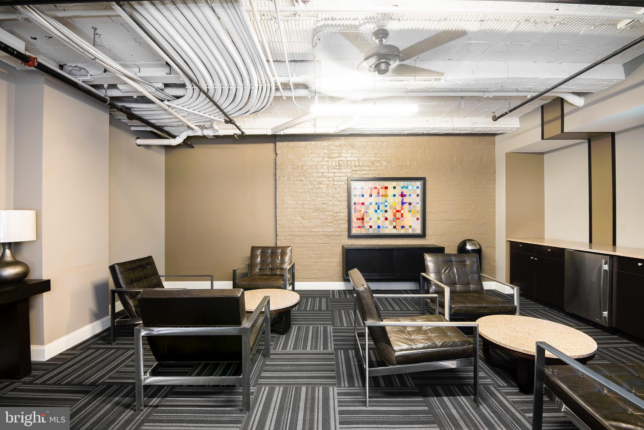 301 North Charles Street, Unit 1BR Baltimore, MD 21202 - Photo 17 of 48 a living room with furniture and a flat screen tv