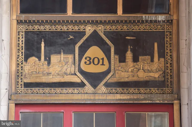 a bathroom with a window and a shower curtain
