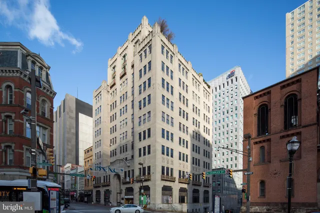 a view of a large white building with large windows