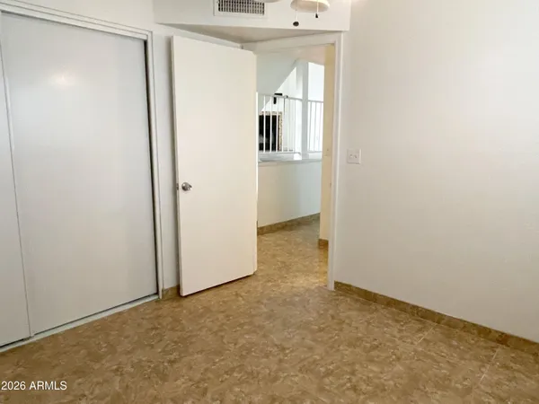 a view of a kitchen from the hallway