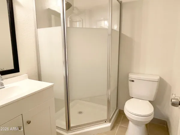 a bathroom with a toilet and a sink