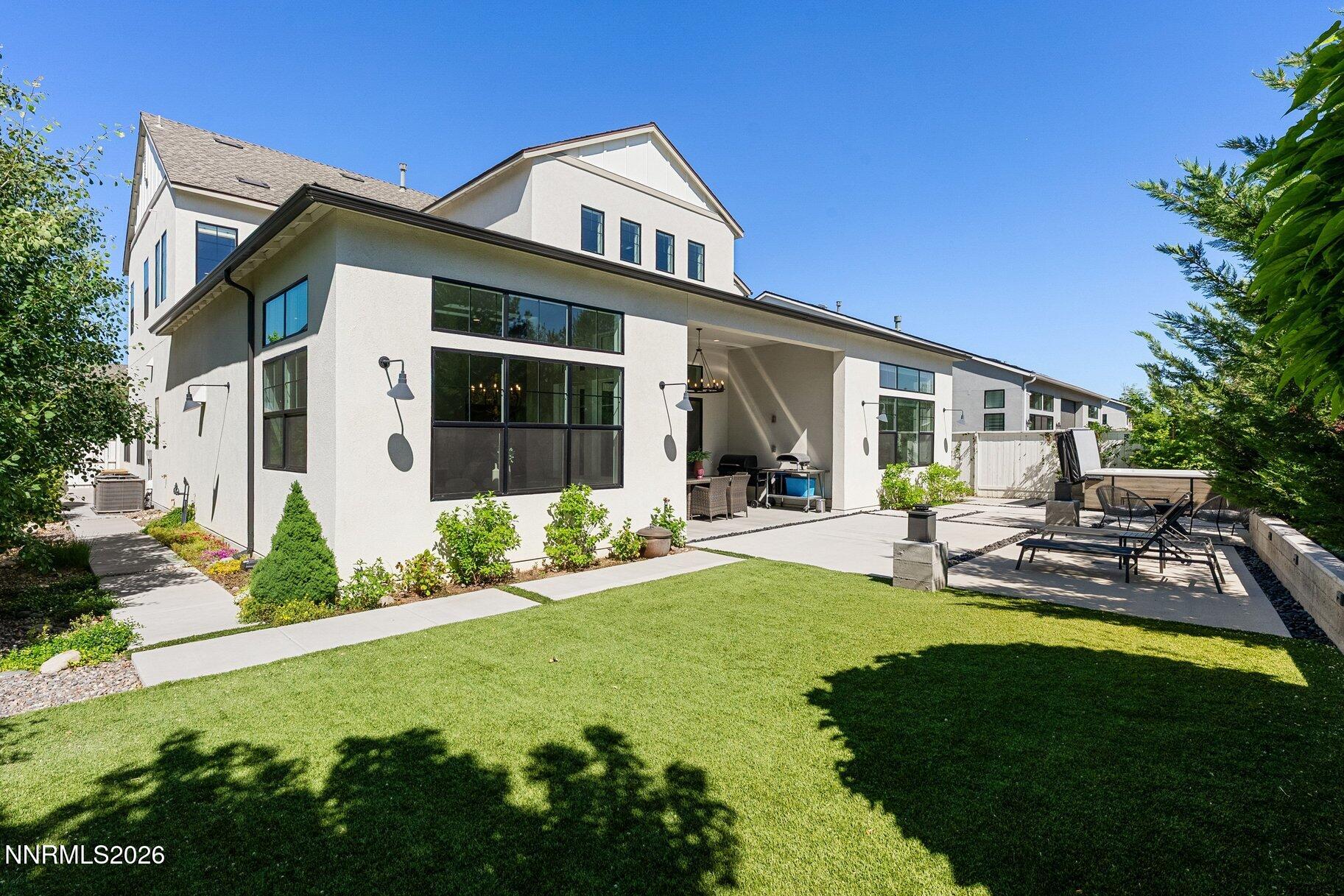 6110 South Pleasant Oak Trail Reno, NV 89511 - Photo 48 of 66 a front view of a house with garden and patio