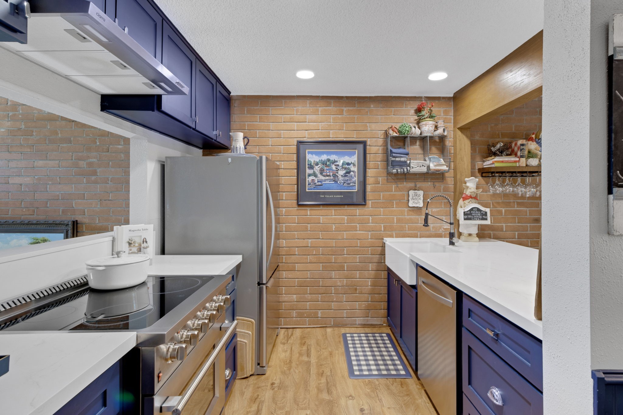 154 Villa Way Coldspring, TX 77331 - Photo 11 of 42 The updated kitchen features new cabinetry, quartz countertops and stainless steel appliances