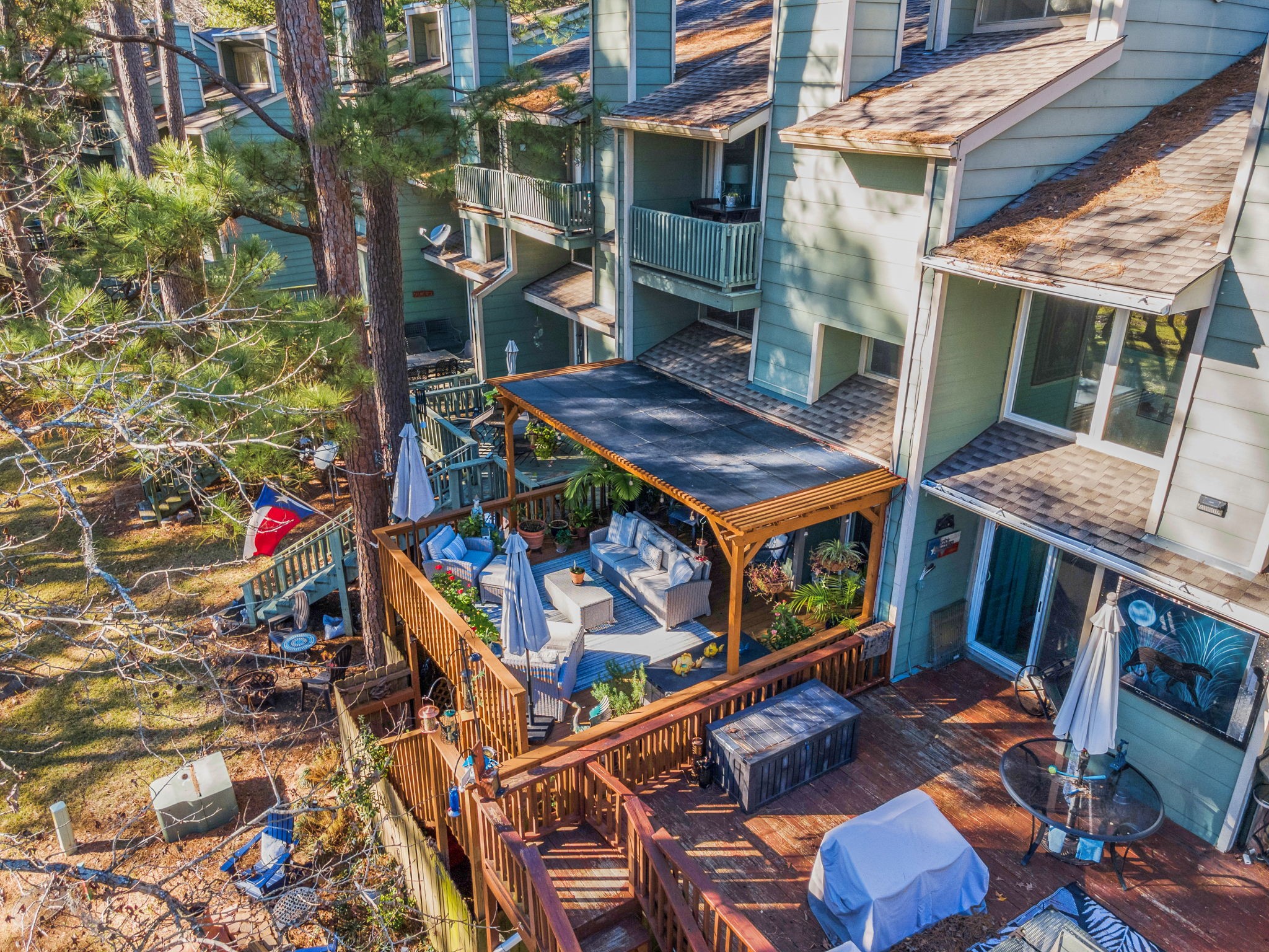 154 Villa Way Coldspring, TX 77331 - Photo 27 of 42 The back deck is a favorite spot, thoughtfully replaced by the current owner and upgraded with a pergola