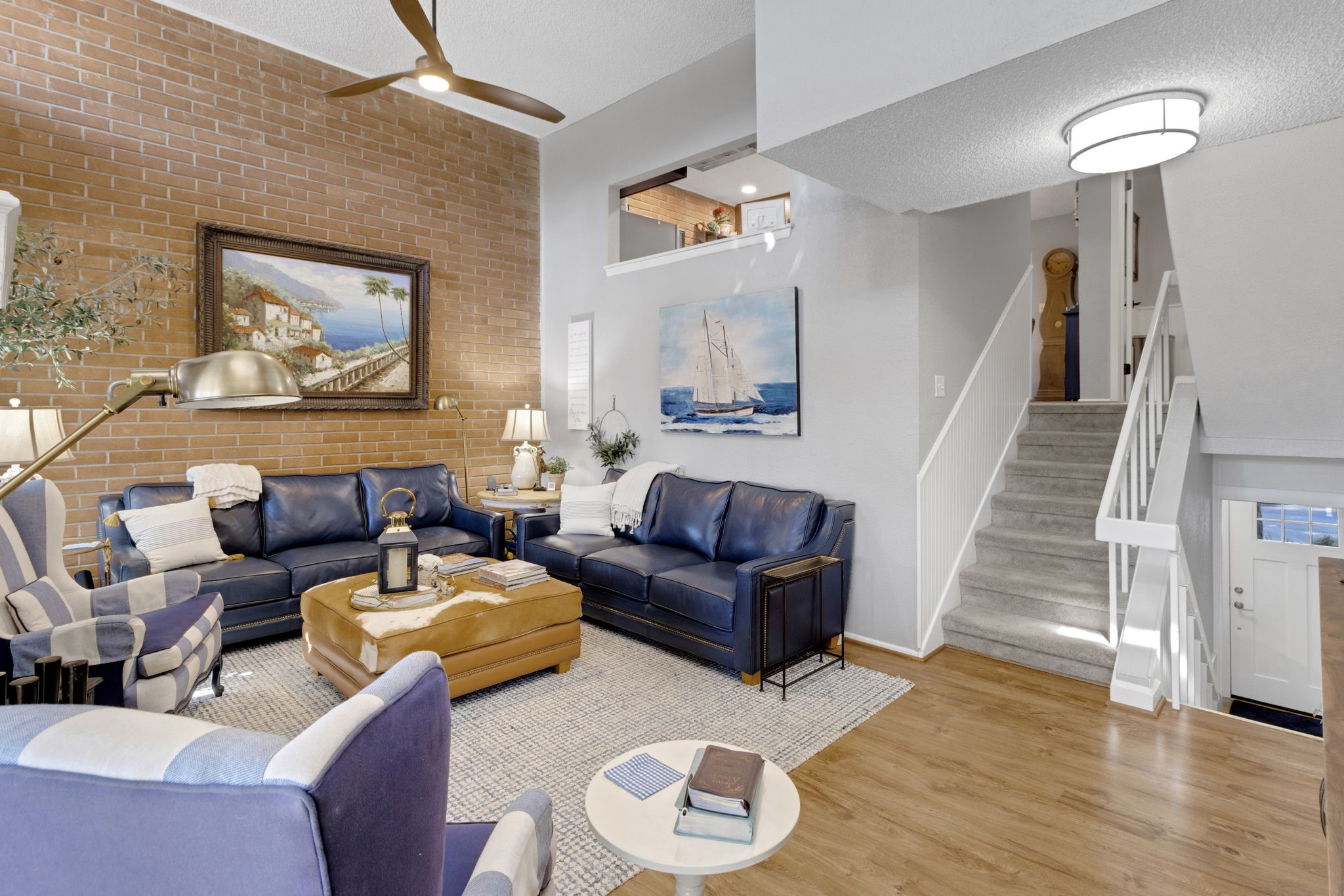 154 Villa Way Coldspring, TX 77331 - Photo 5 of 42 The inviting living area is highlighted by the brick accent wall adding warmth and character to the space