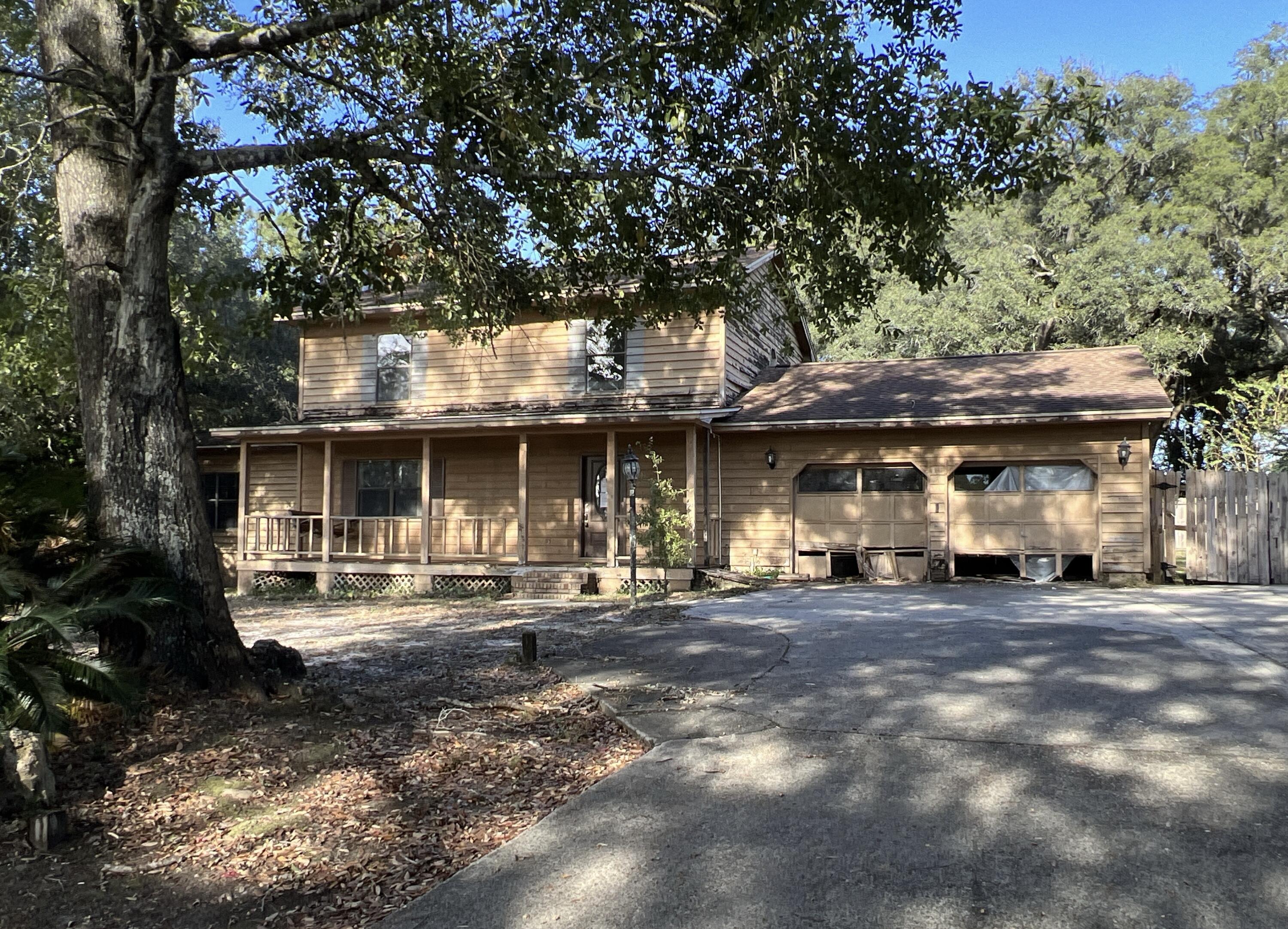a front view of a house with a sitting area