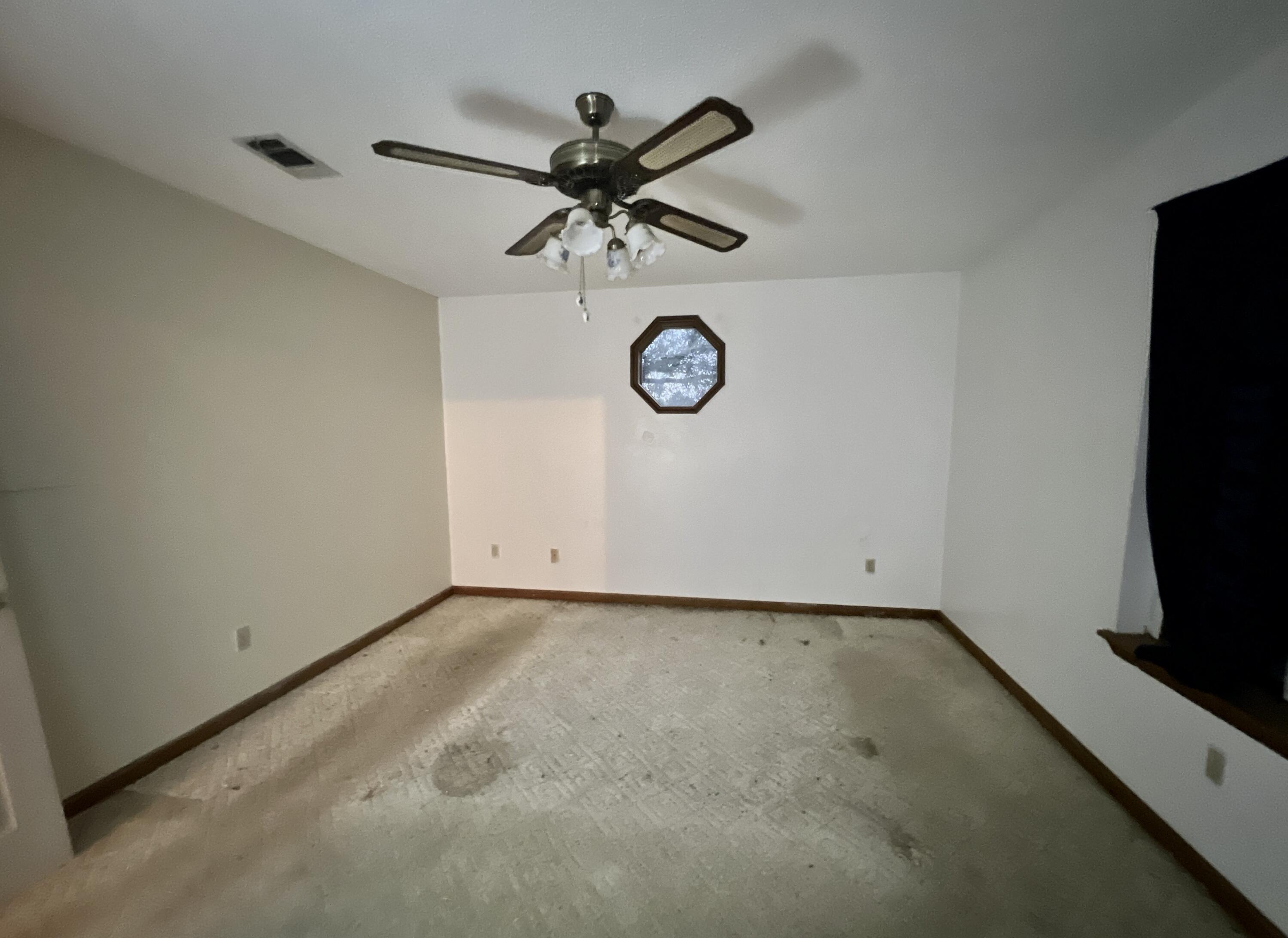 4746 Pebble Creek Drive Pensacola, FL 32526 - Photo 11 of 23 a view of a room with a fan and a window