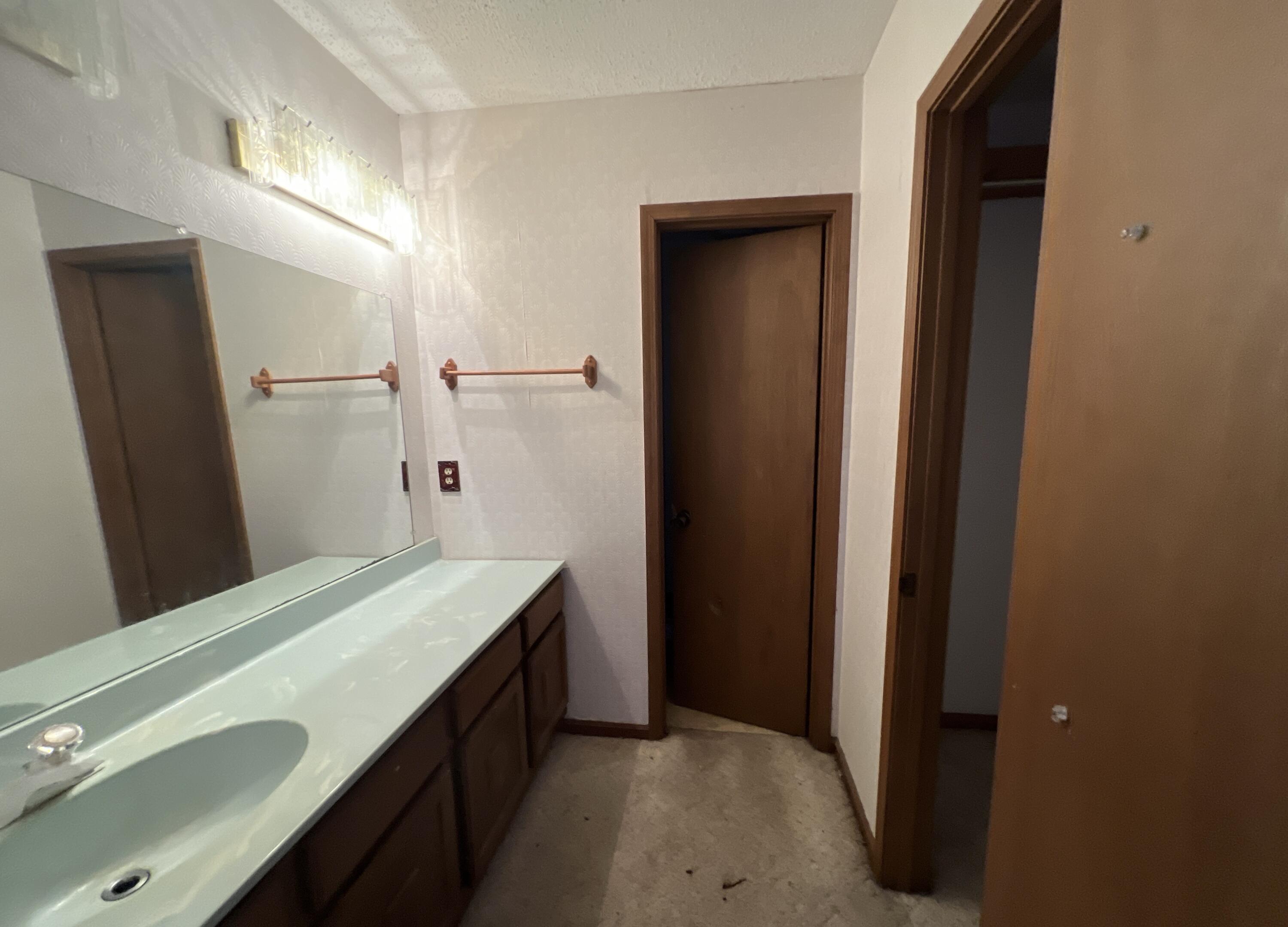 4746 Pebble Creek Drive Pensacola, FL 32526 - Photo 12 of 23 a bathroom with a double vanity sink and mirror