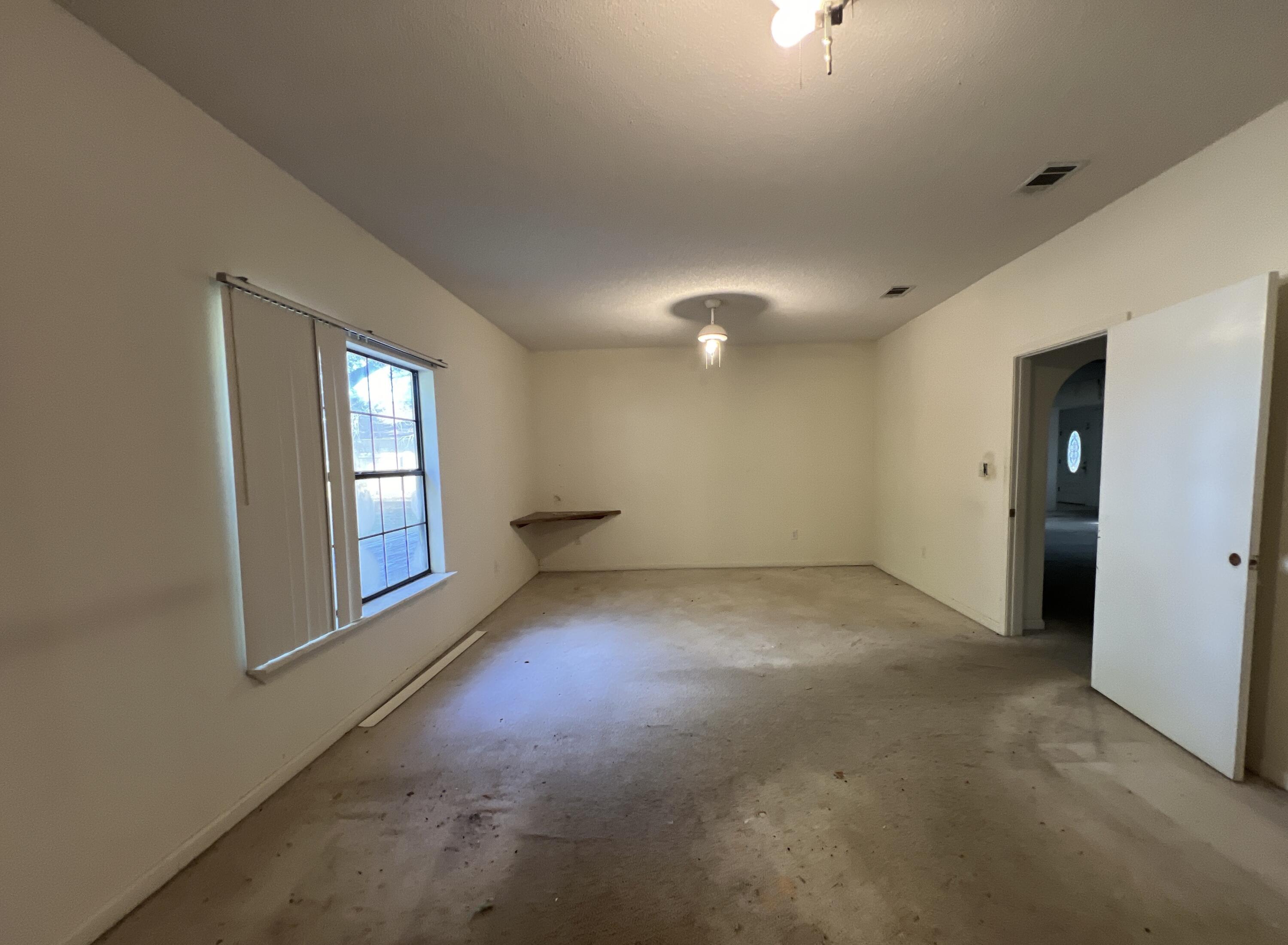 4746 Pebble Creek Drive Pensacola, FL 32526 - Photo 14 of 23 an empty room with windows and entrance