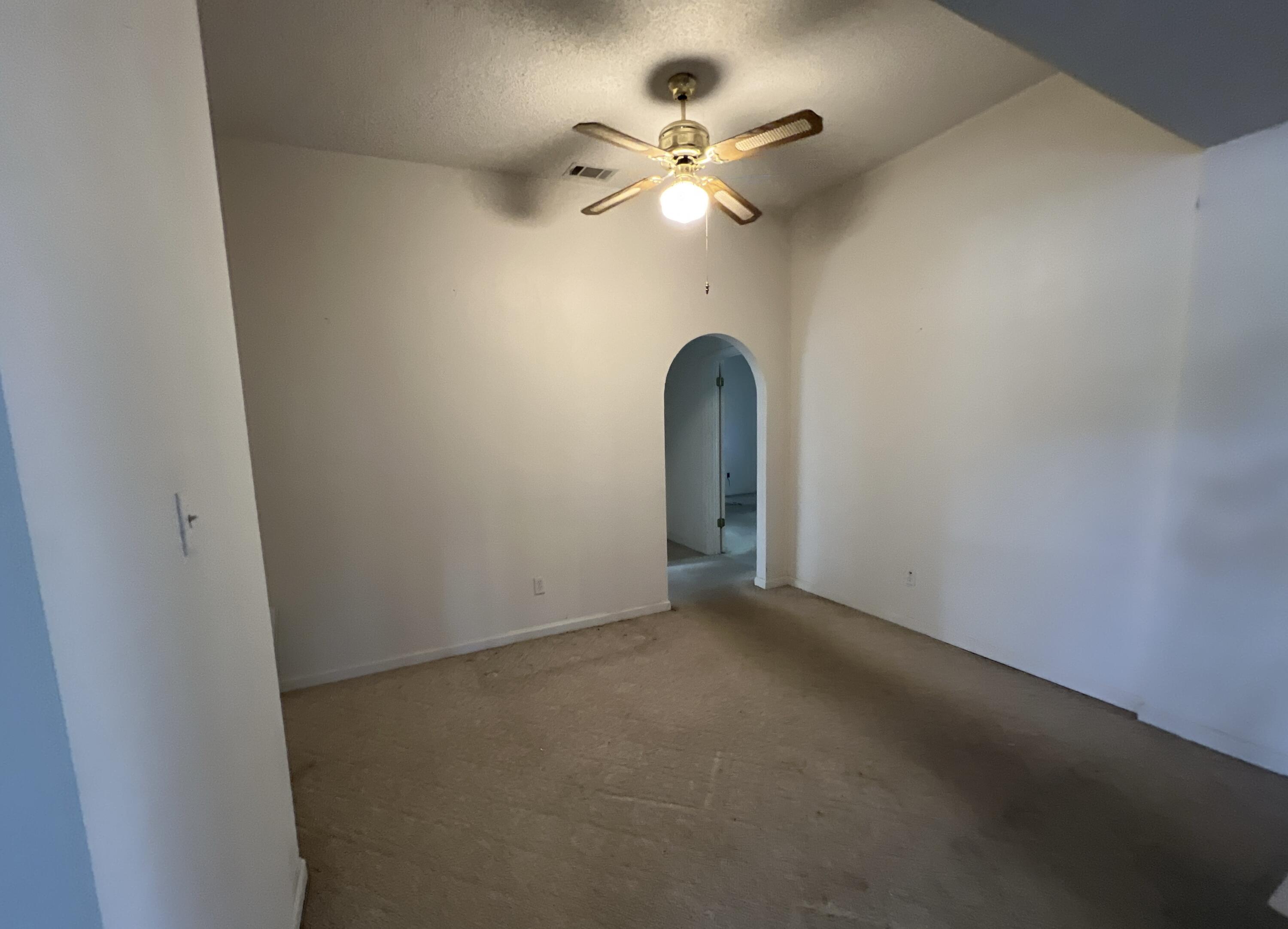 4746 Pebble Creek Drive Pensacola, FL 32526 - Photo 15 of 23 an empty room with windows and fan
