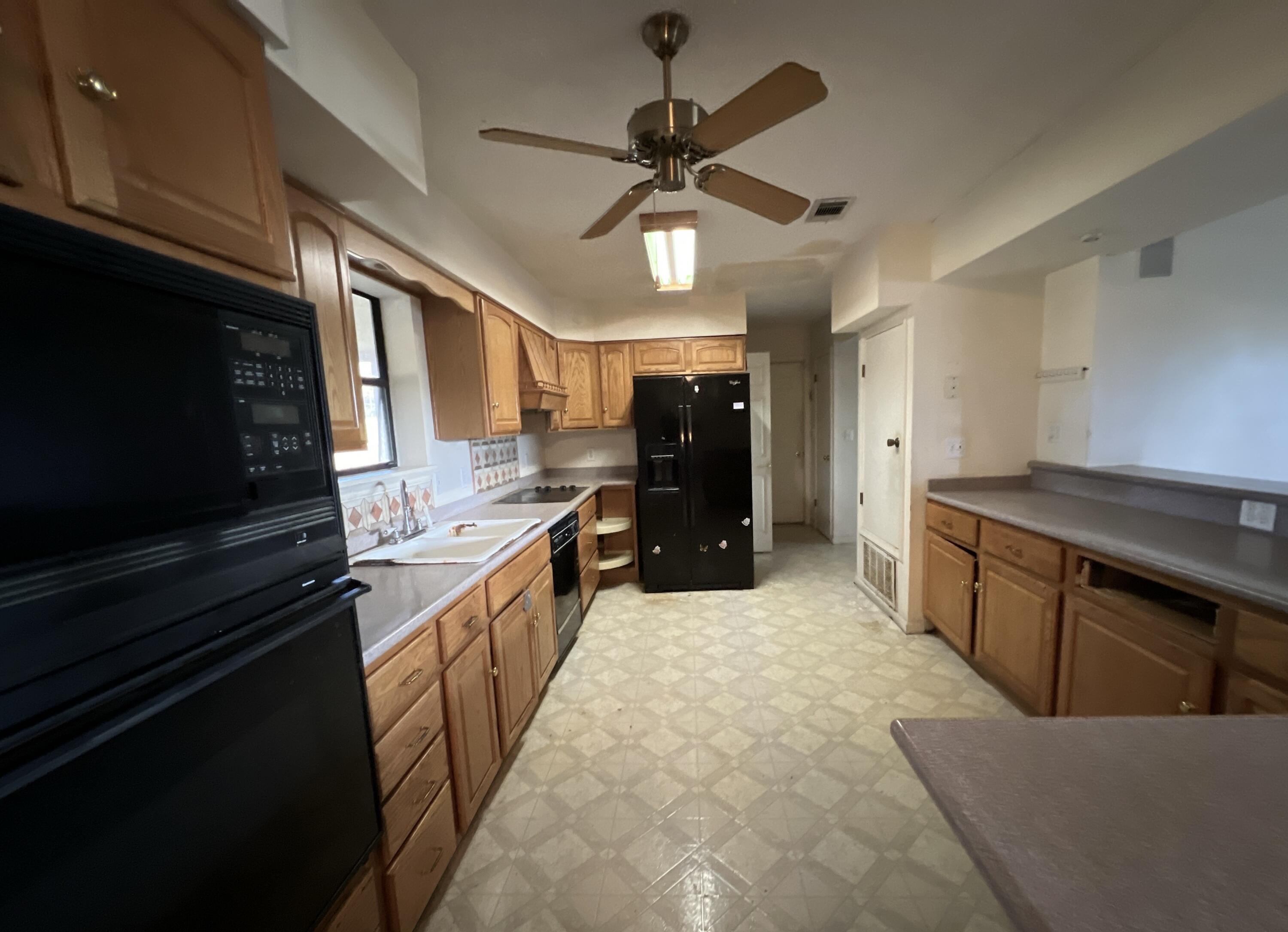 4746 Pebble Creek Drive Pensacola, FL 32526 - Photo 16 of 23 a open kitchen with stainless steel appliances granite countertop a refrigerator a stove top oven a sink and dishwasher