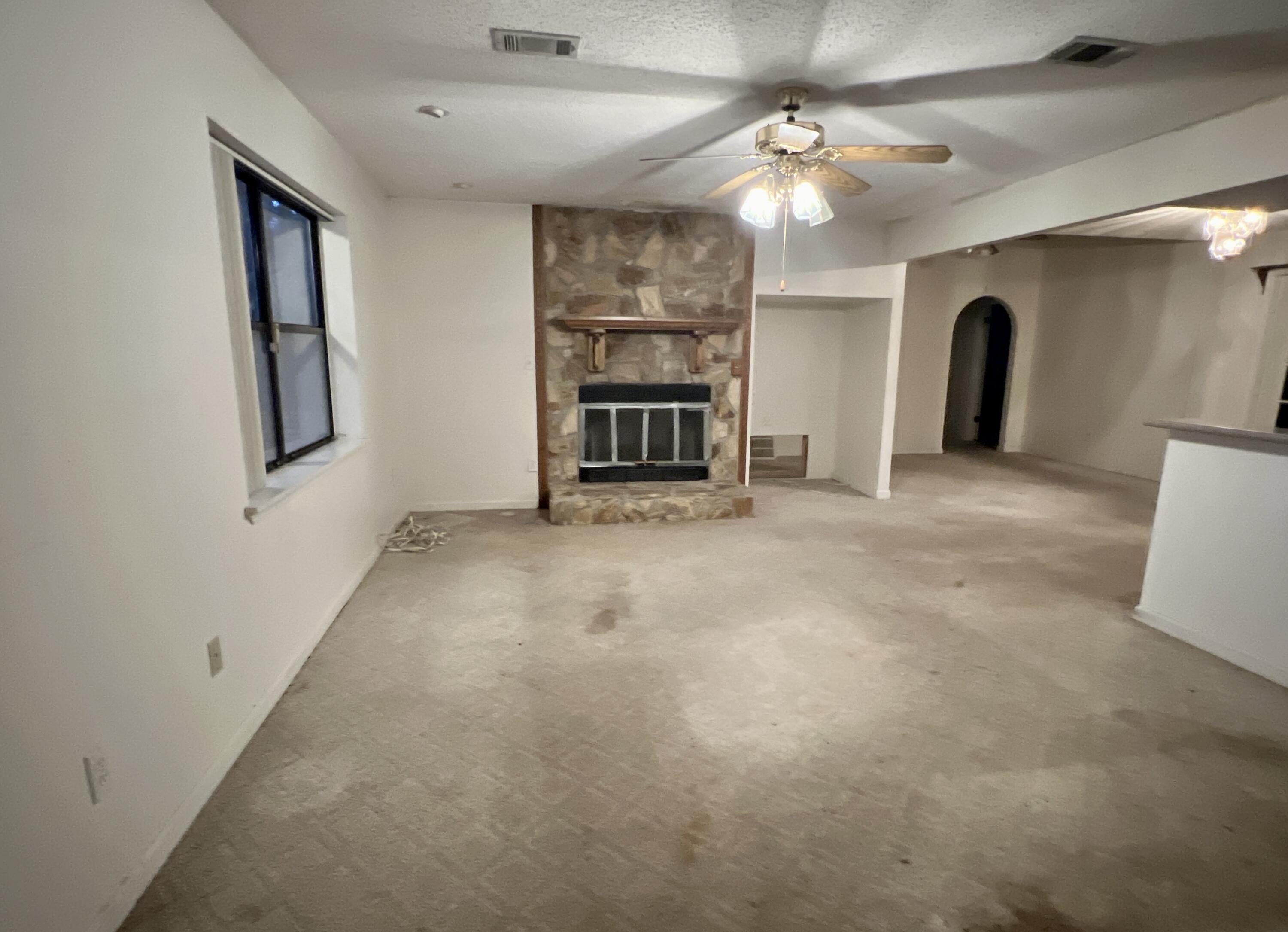 4746 Pebble Creek Drive Pensacola, FL 32526 - Photo 2 of 23 wooden floor in an empty room with a window