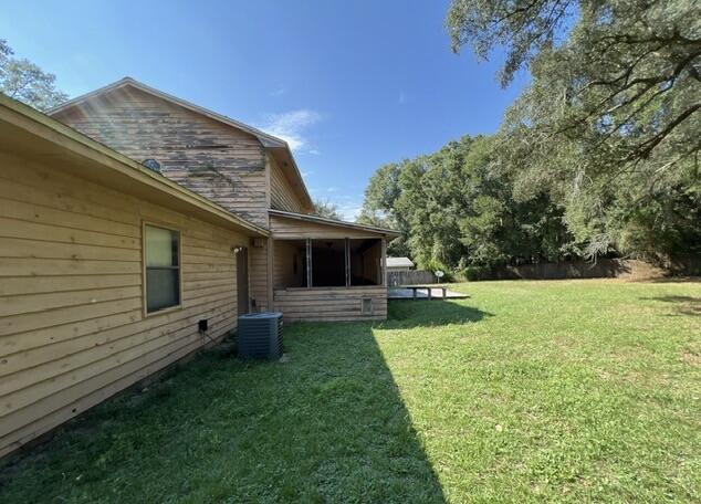 4746 Pebble Creek Drive Pensacola, FL 32526 - Photo 21 of 23 a view of a backyard with plants and a backyard