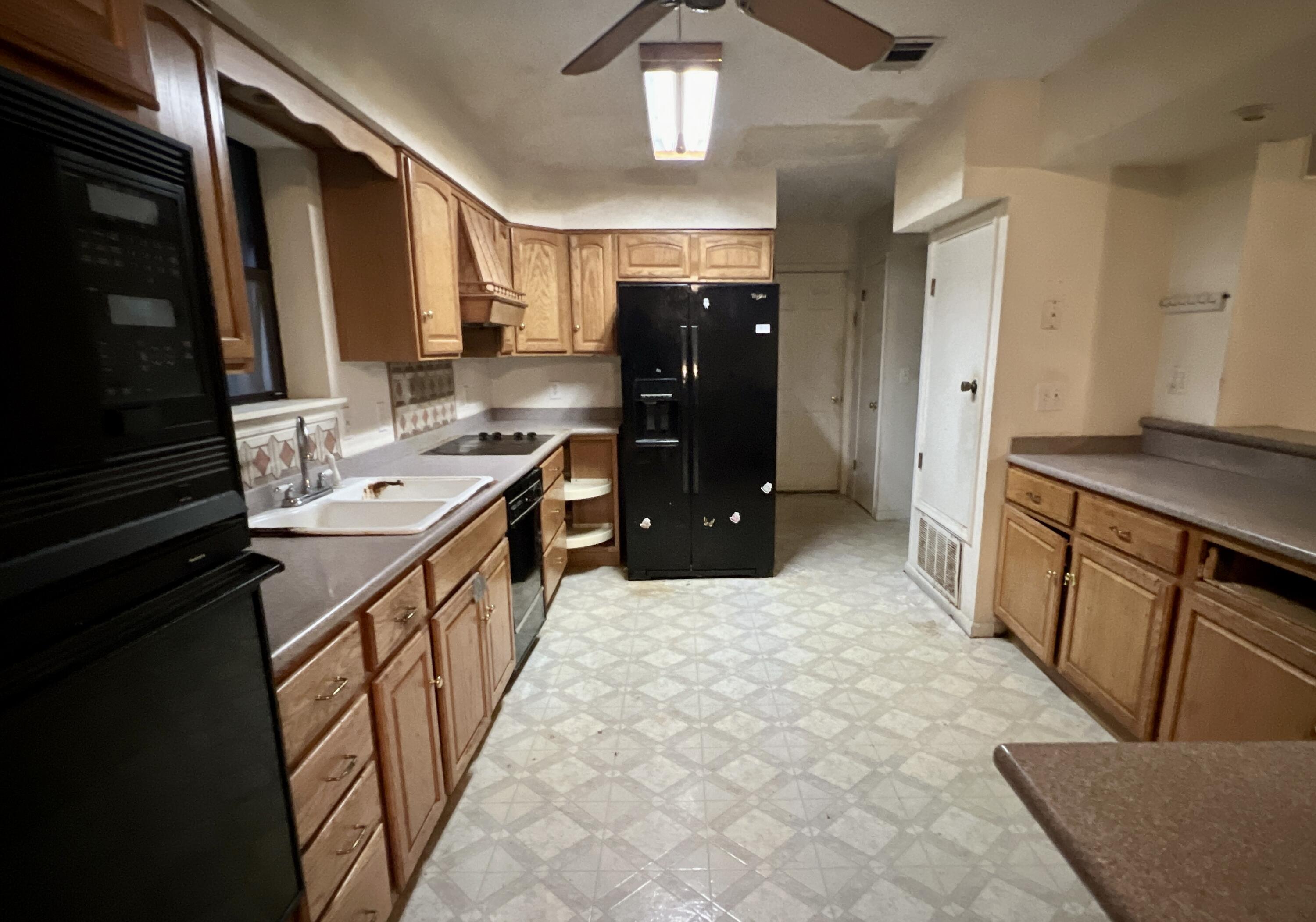 4746 Pebble Creek Drive Pensacola, FL 32526 - Photo 3 of 23 a kitchen with sink and refrigerator
