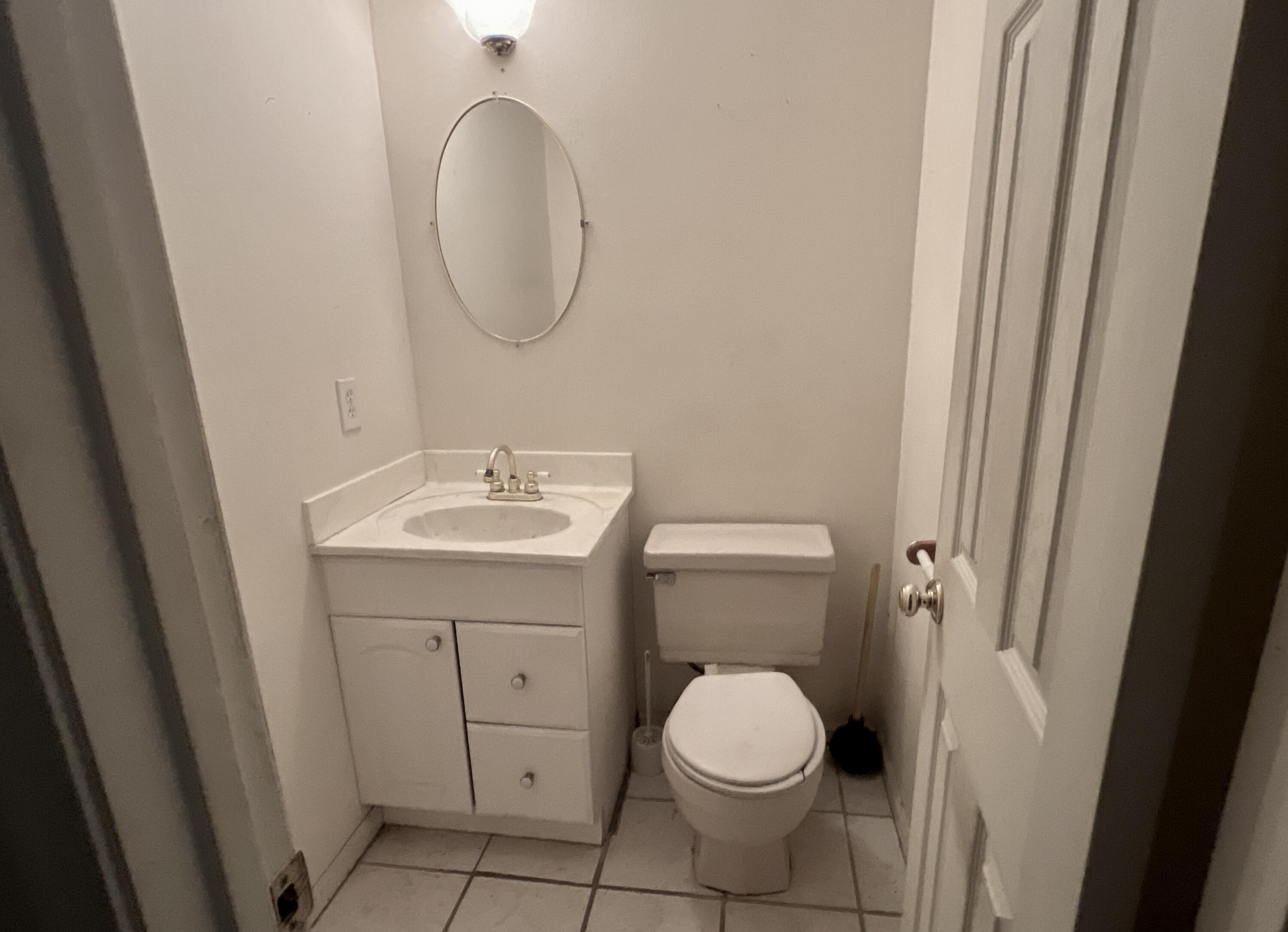 4746 Pebble Creek Drive Pensacola, FL 32526 - Photo 6 of 23 a bathroom with a sink and a mirror