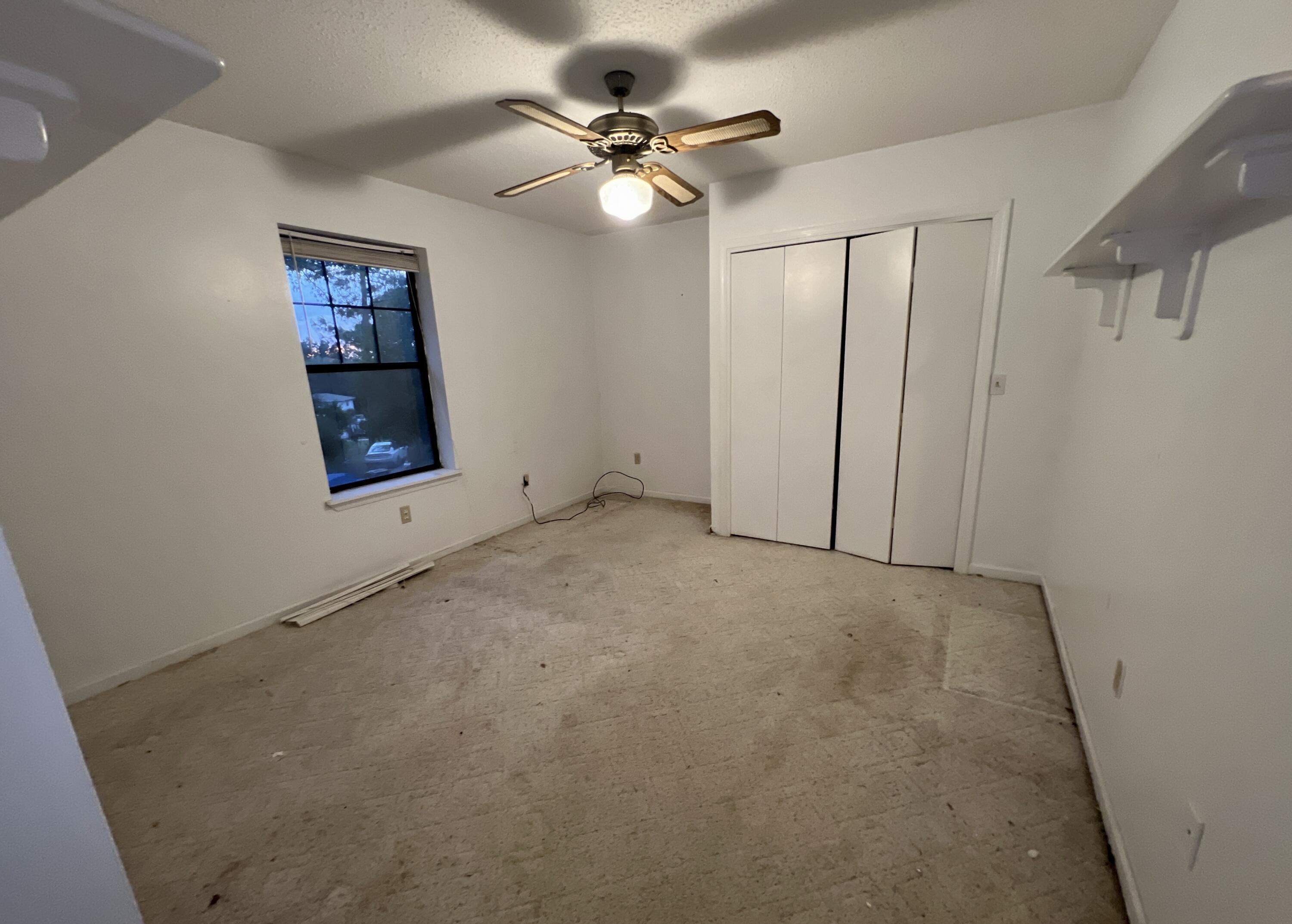4746 Pebble Creek Drive Pensacola, FL 32526 - Photo 10 of 23 an empty room with windows and fan
