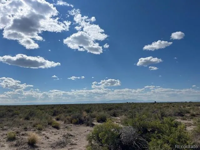 a view of a house with a big yard
