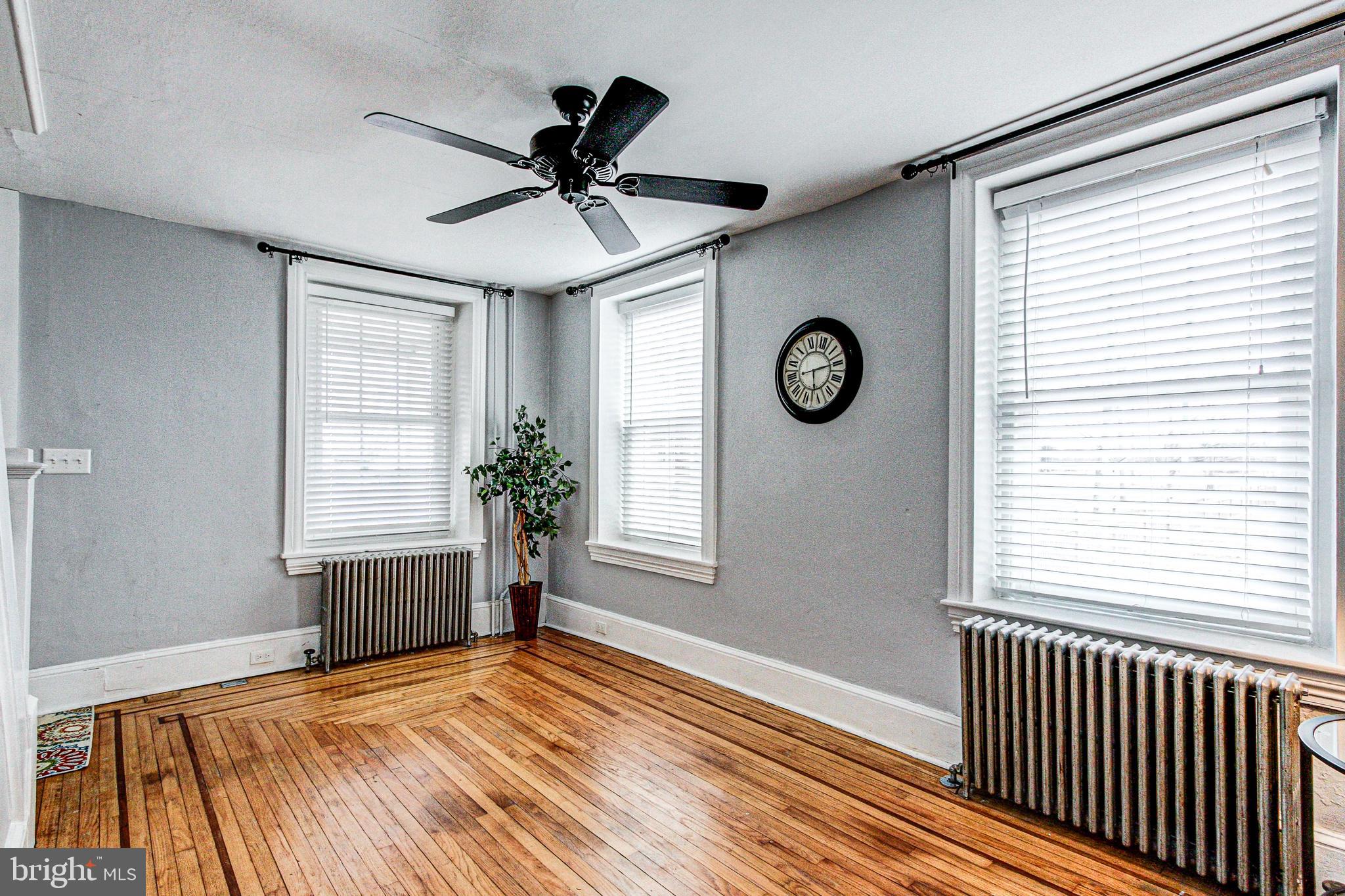 1079 Old Skippack Road Harleysville, PA 19438 - Photo 11 of 53 a view of empty room with wooden floor and fan