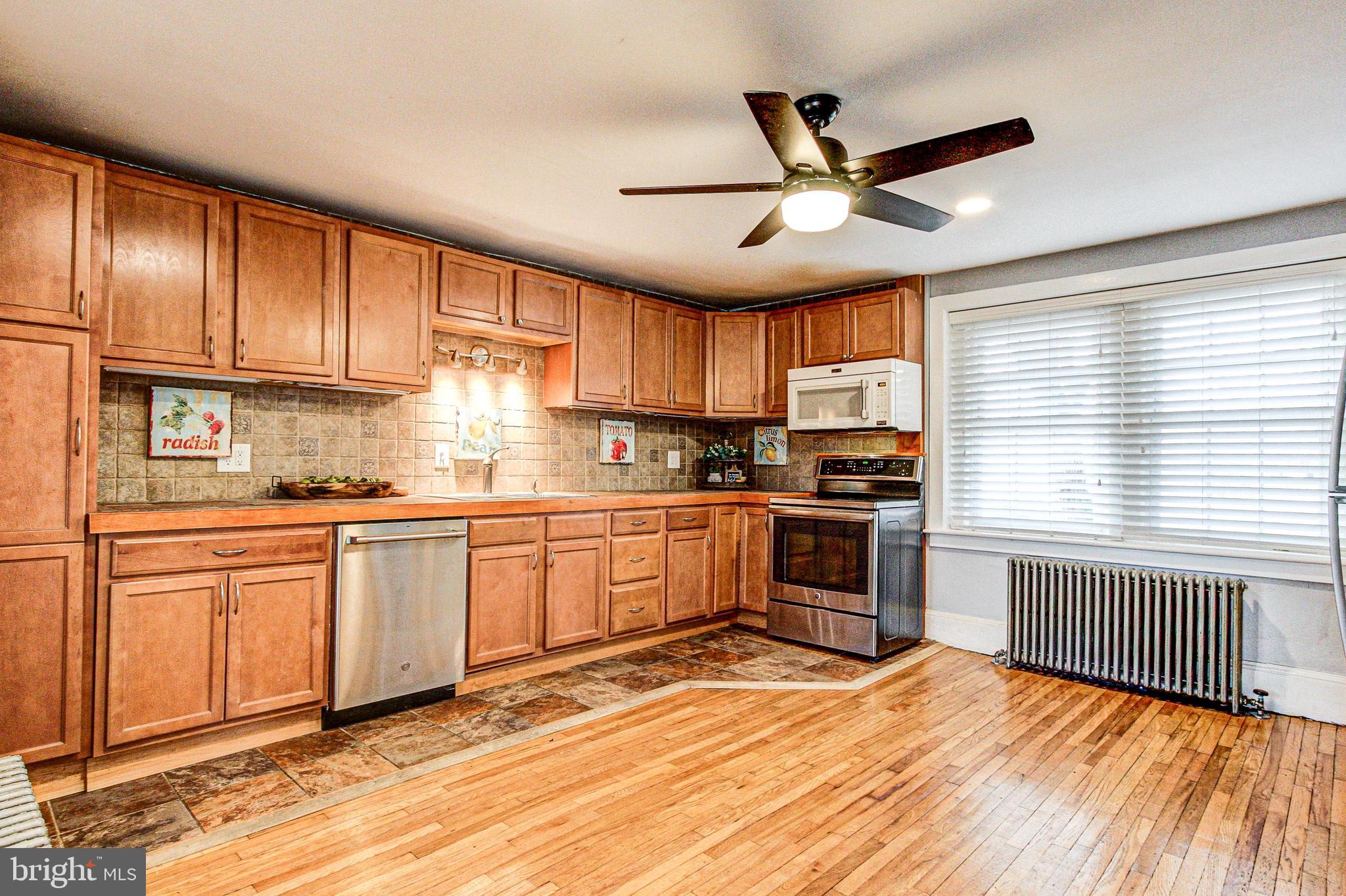 1079 Old Skippack Road Harleysville, PA 19438 - Photo 15 of 53 a kitchen with granite countertop stainless steel appliances cabinets a window and a sink