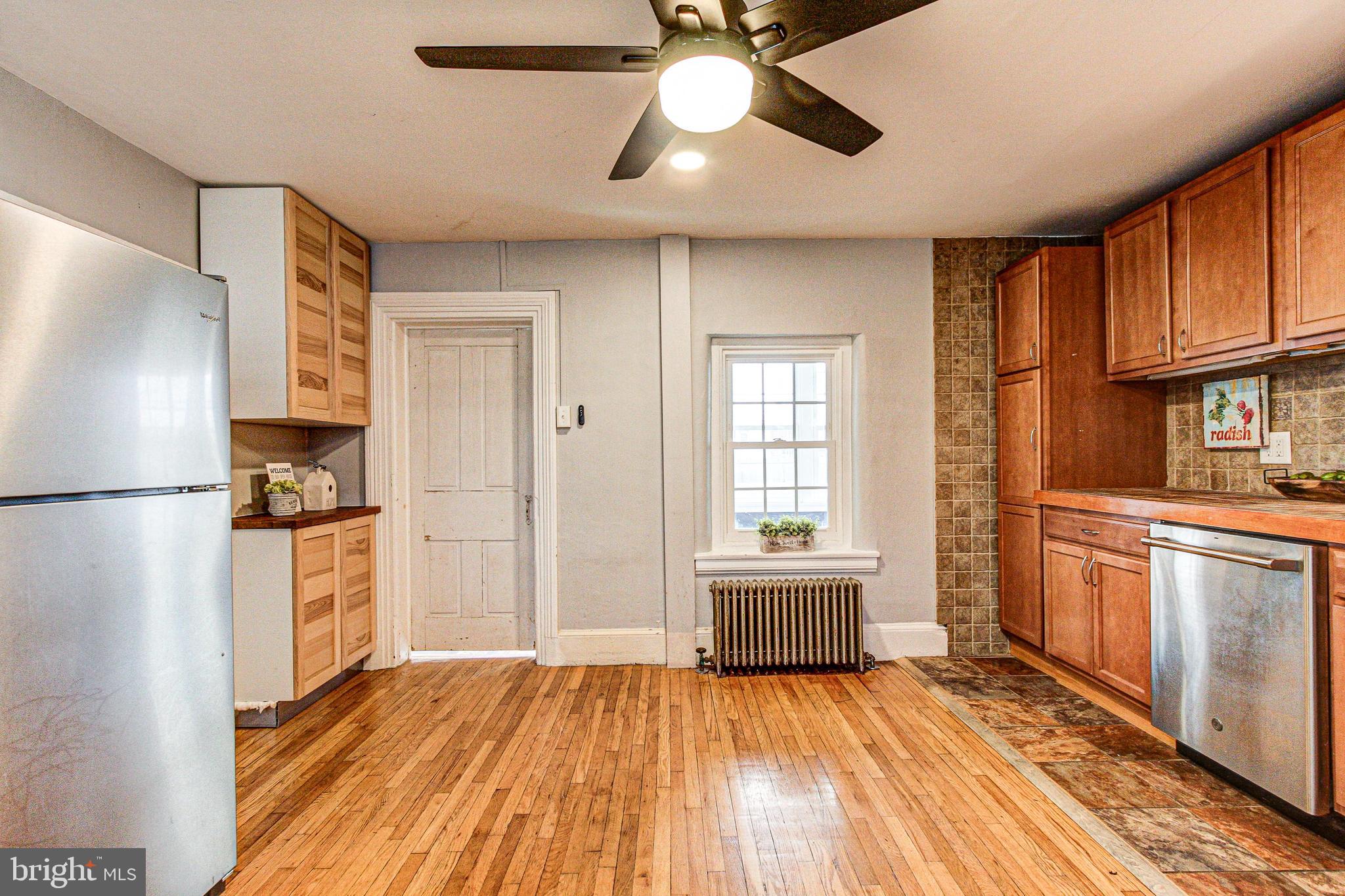 1079 Old Skippack Road Harleysville, PA 19438 - Photo 20 of 53 a kitchen with a refrigerator and a stove top oven