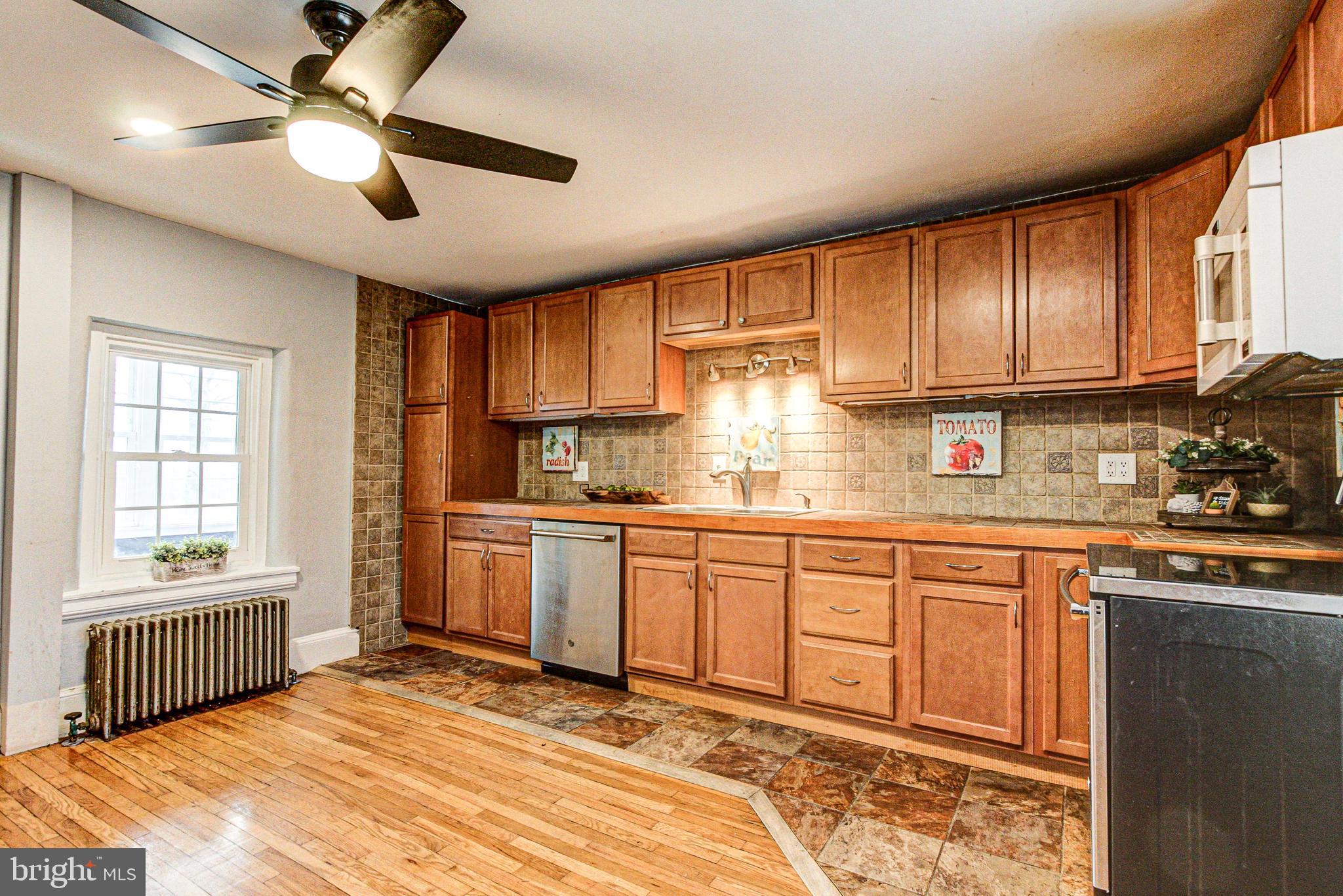 1079 Old Skippack Road Harleysville, PA 19438 - Photo 21 of 53 a kitchen with stainless steel appliances granite countertop a stove sink and cabinets