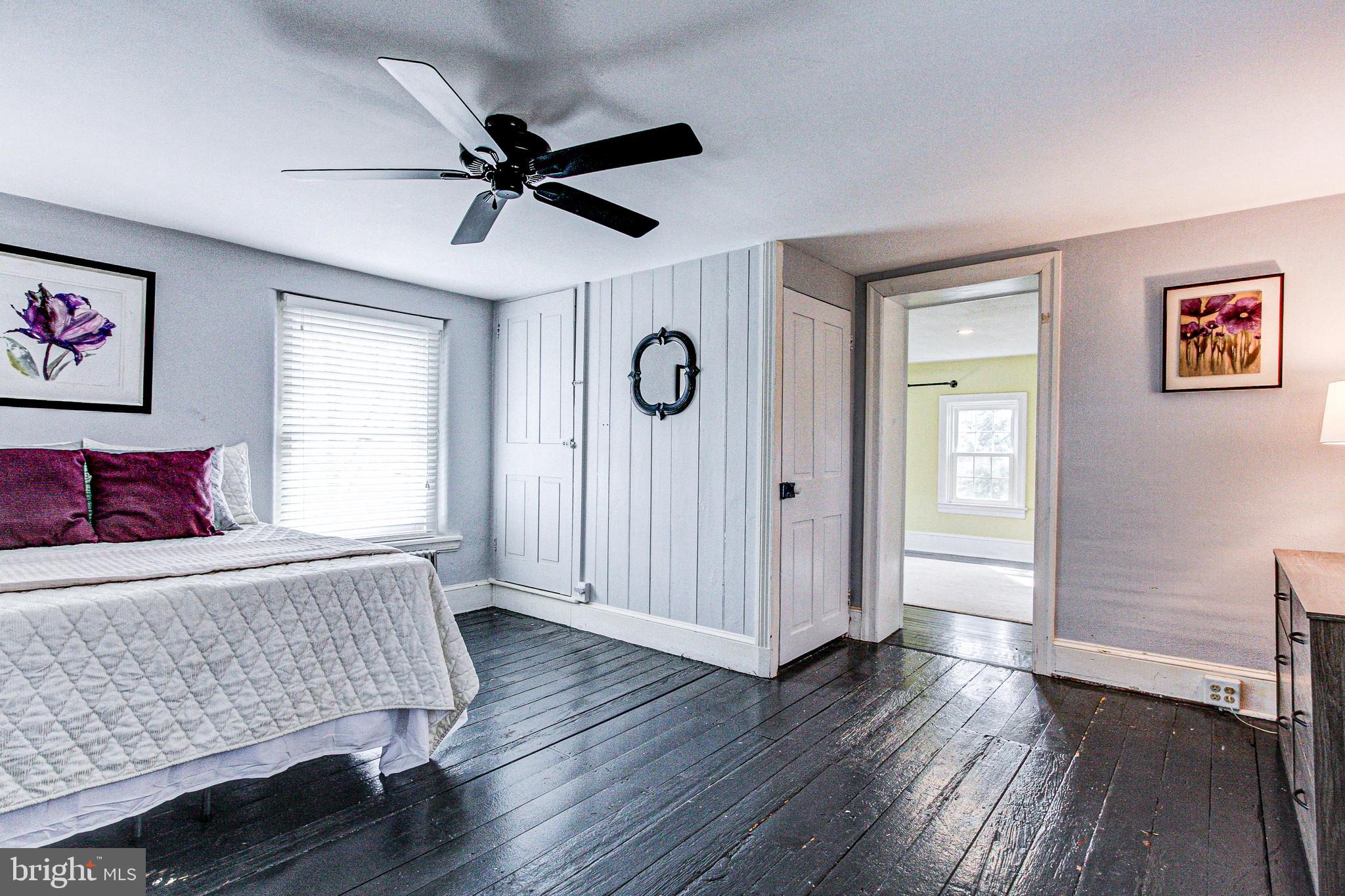 1079 Old Skippack Road Harleysville, PA 19438 - Photo 29 of 53 a bedroom with a bed and wooden floor