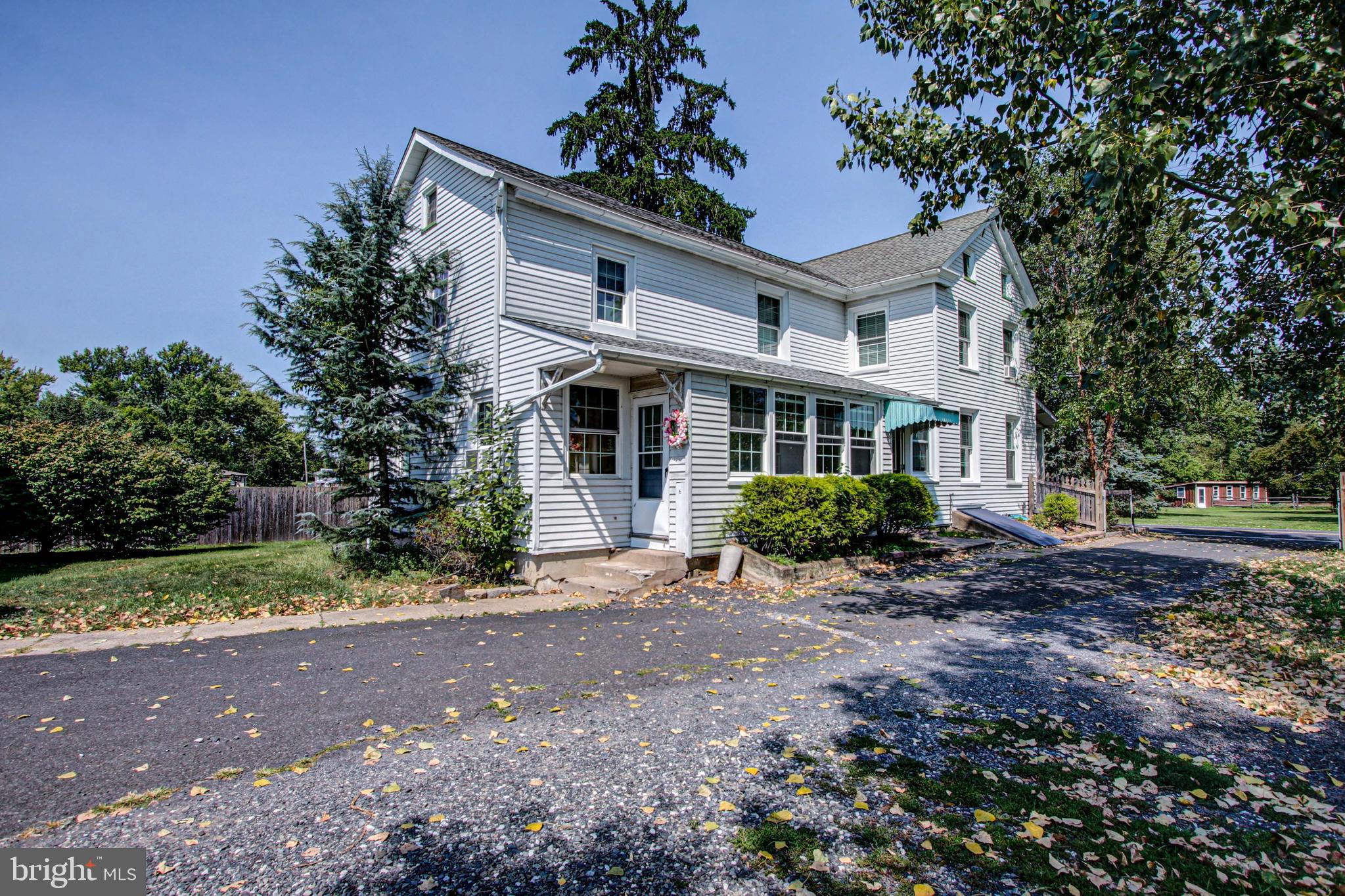 1079 Old Skippack Road Harleysville, PA 19438 - Photo 3 of 53 a front view of a house with a garden