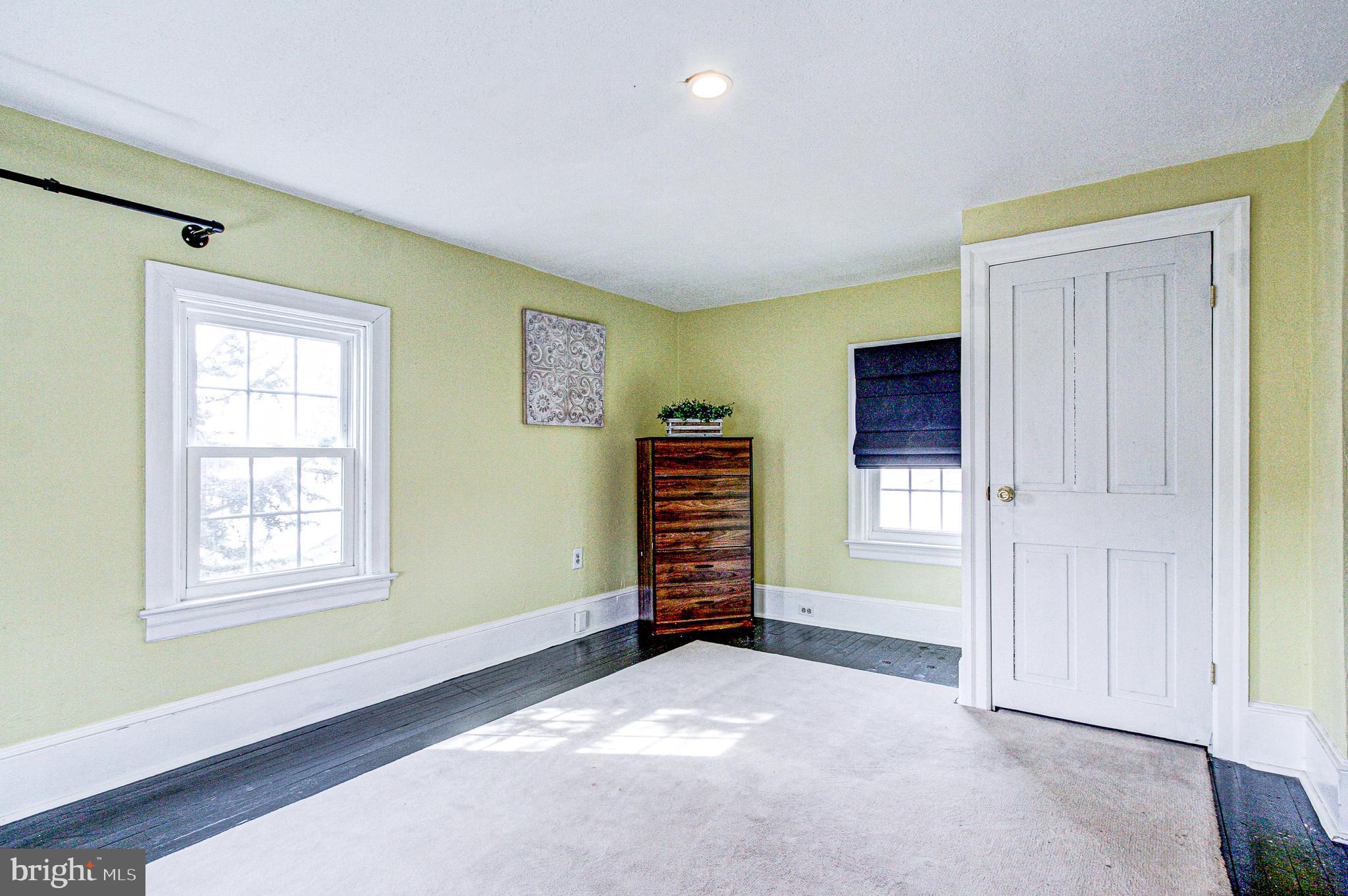 1079 Old Skippack Road Harleysville, PA 19438 - Photo 35 of 53 an empty room with windows and closet
