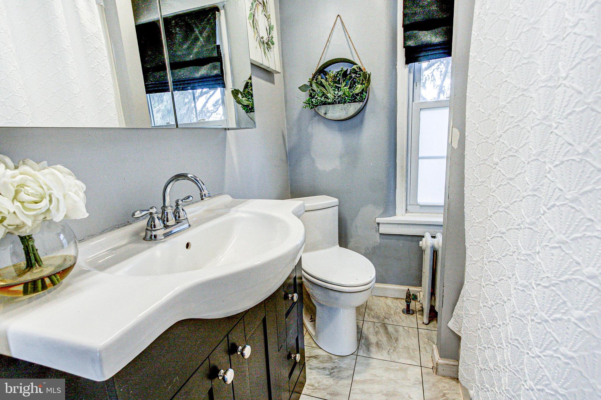 1079 Old Skippack Road Harleysville, PA 19438 - Photo 40 of 53 a bathroom with a sink and a toilet