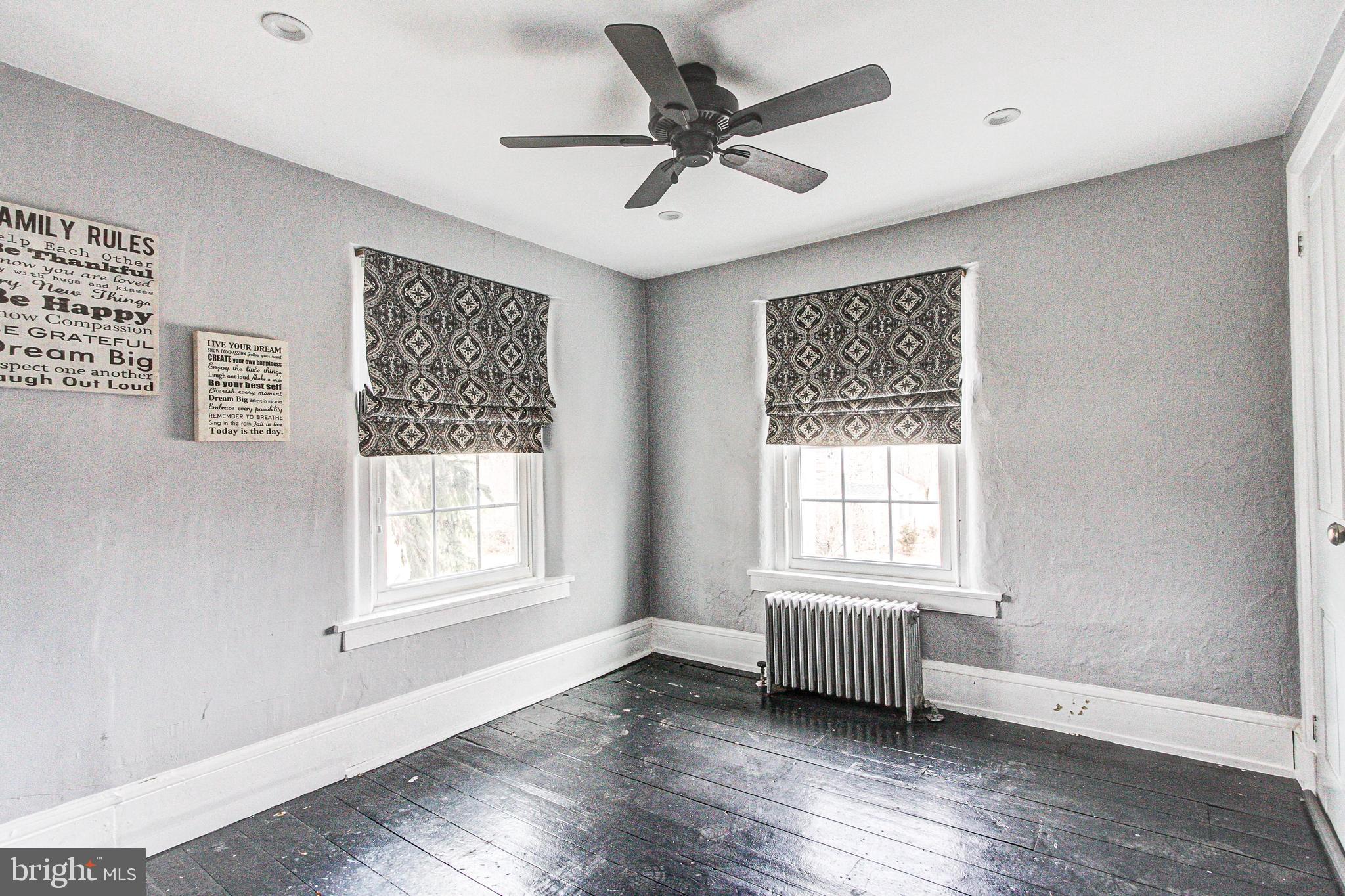 1079 Old Skippack Road Harleysville, PA 19438 - Photo 41 of 53 a view of an empty room with a window and wooden floor