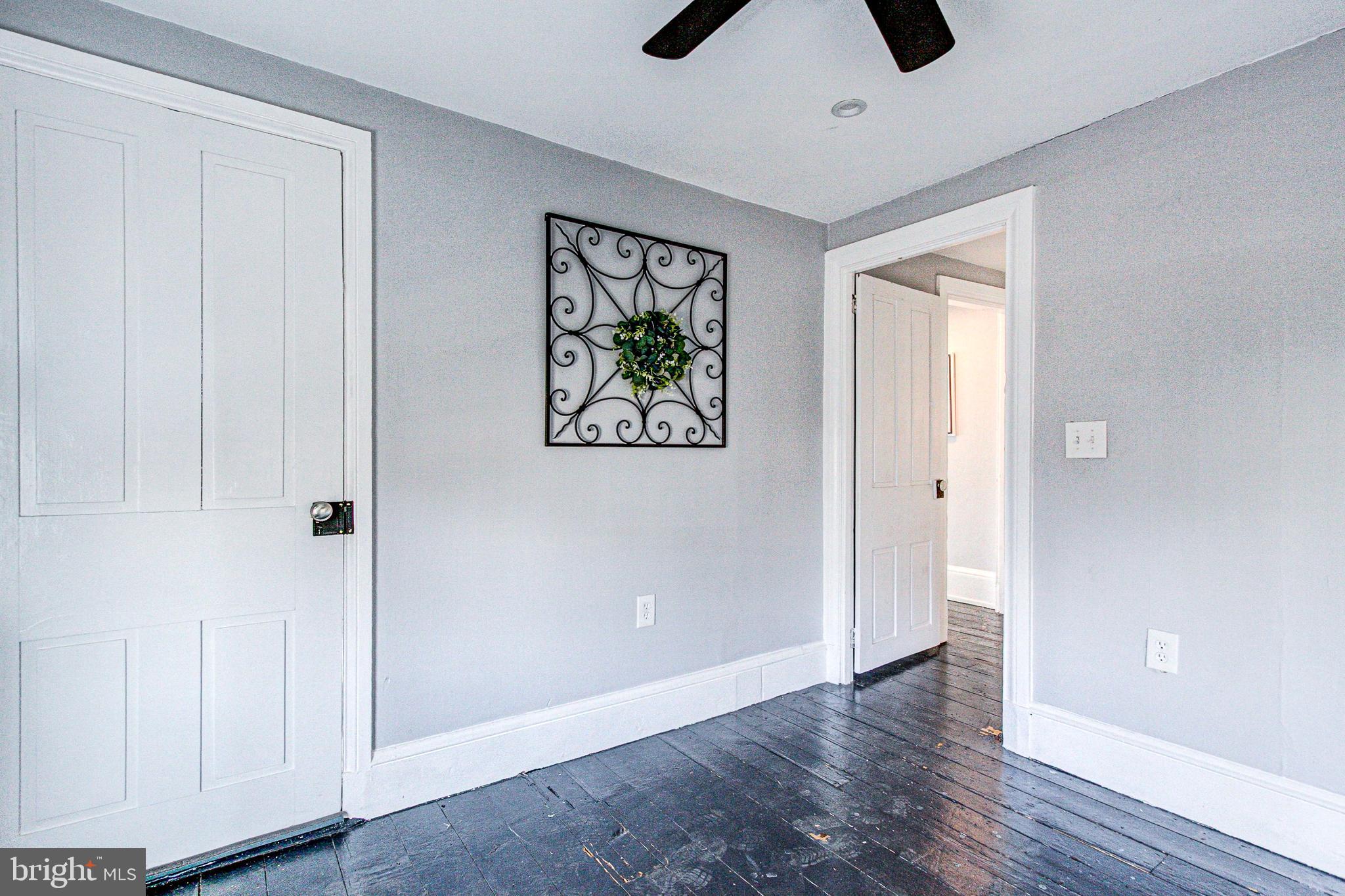 1079 Old Skippack Road Harleysville, PA 19438 - Photo 42 of 53 a view of an empty room with wooden floor